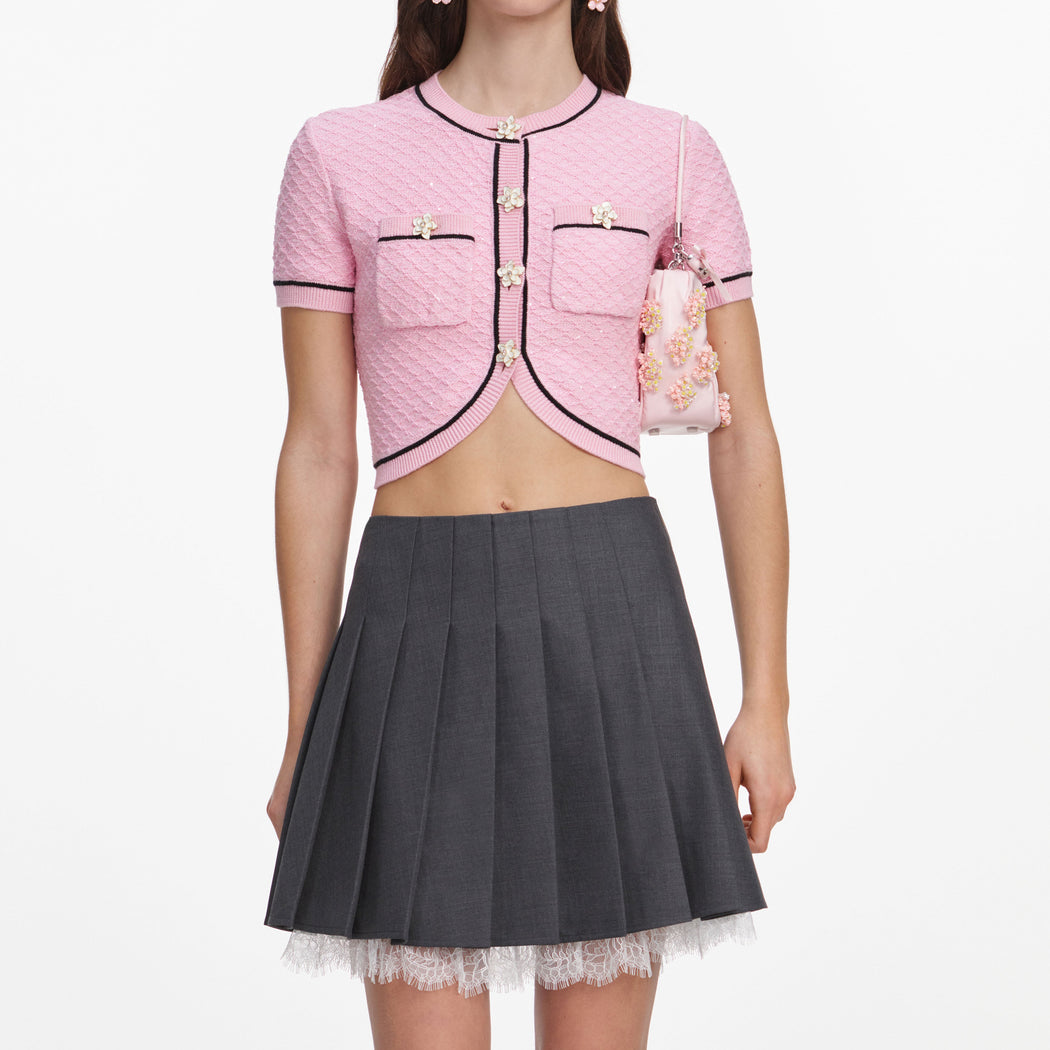 A close up of a woman wearing the Pink Flower Knit Top