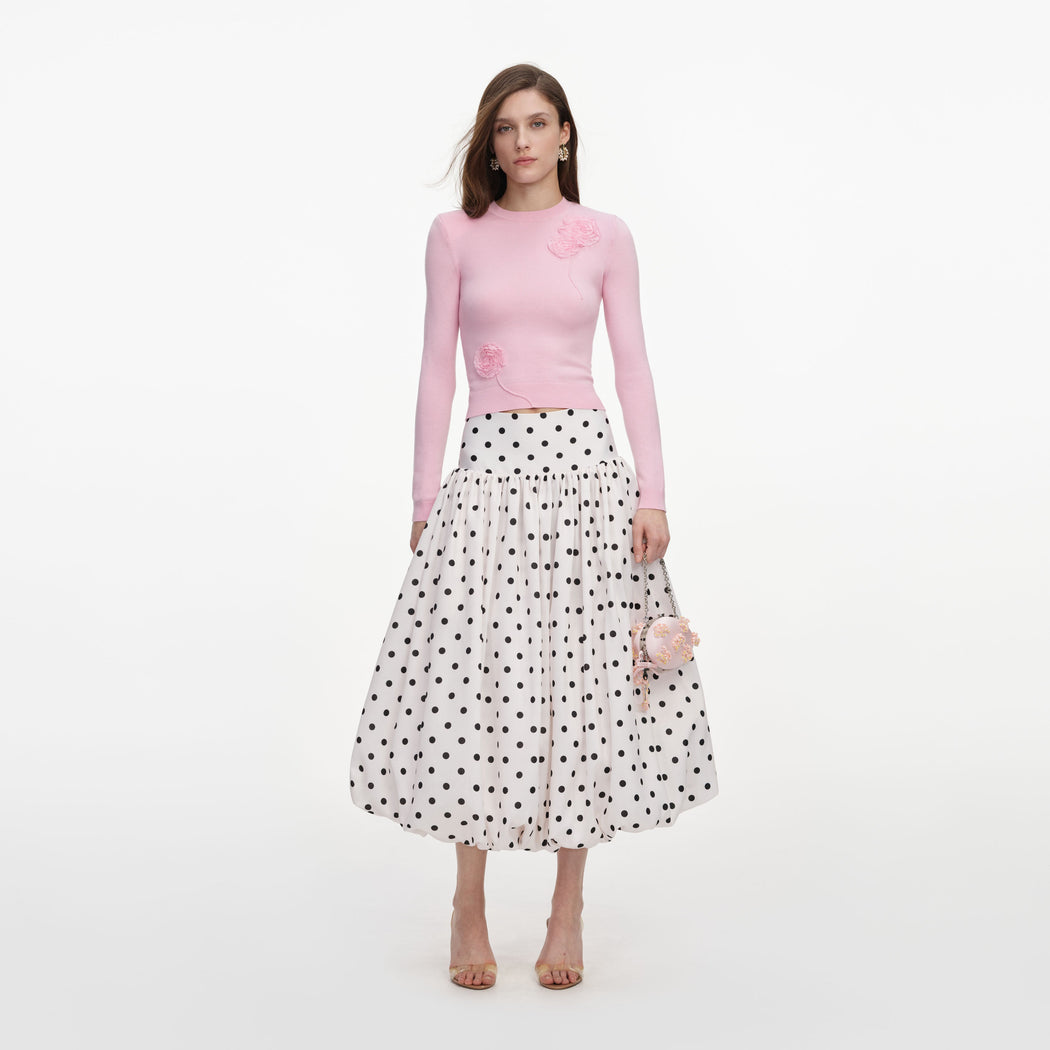 Front view of a woman wearing the Cream Polka Dot Taffeta Midi Skirt