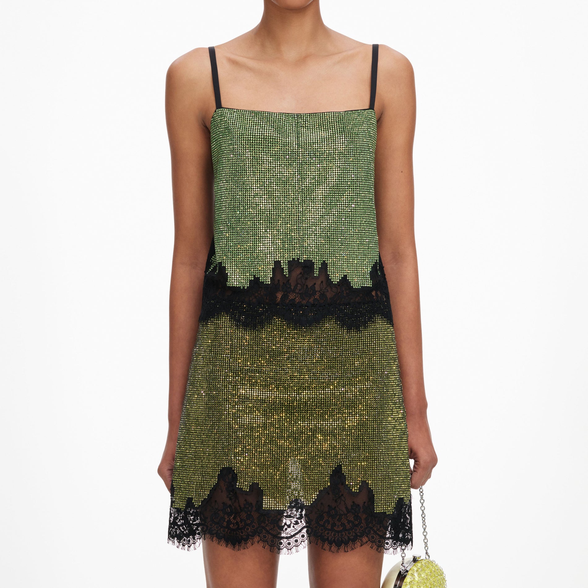 A close up of a woman wearing the Green Crystal Chainmail Top