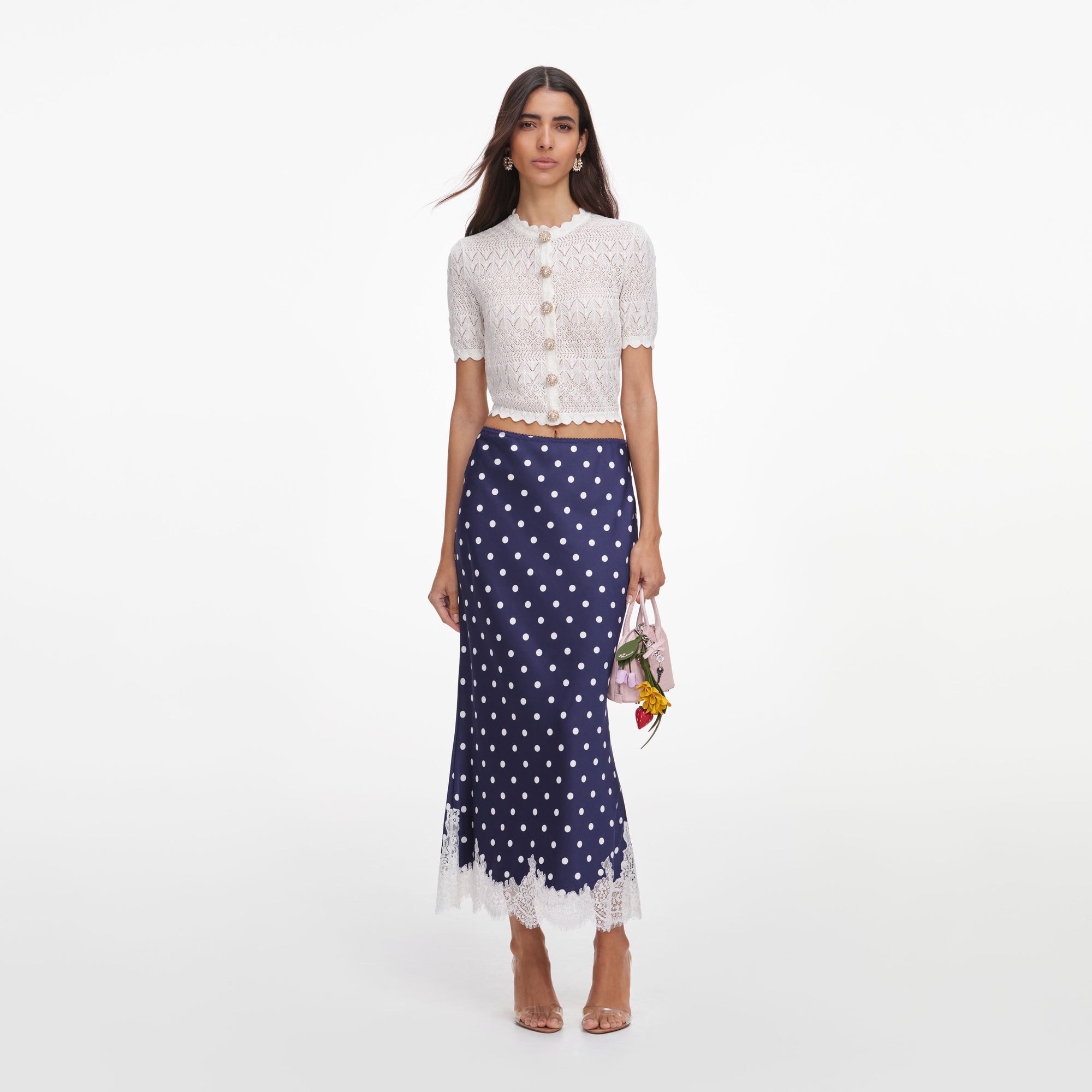 Front view of a woman wearing the White Pointelle Knit Top
