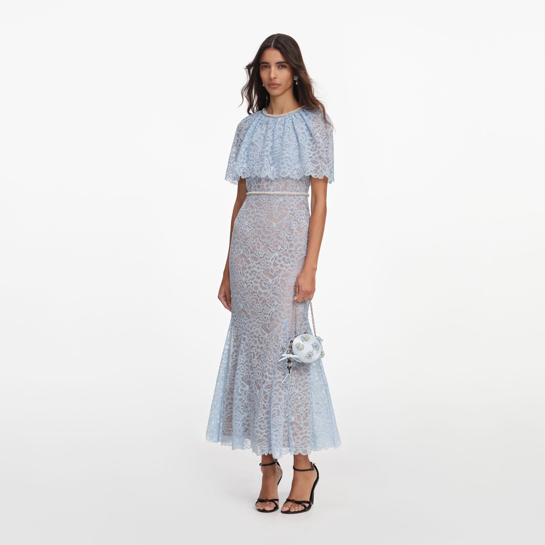Side view of a woman wearing the Blue Lace Cape Midi Dress