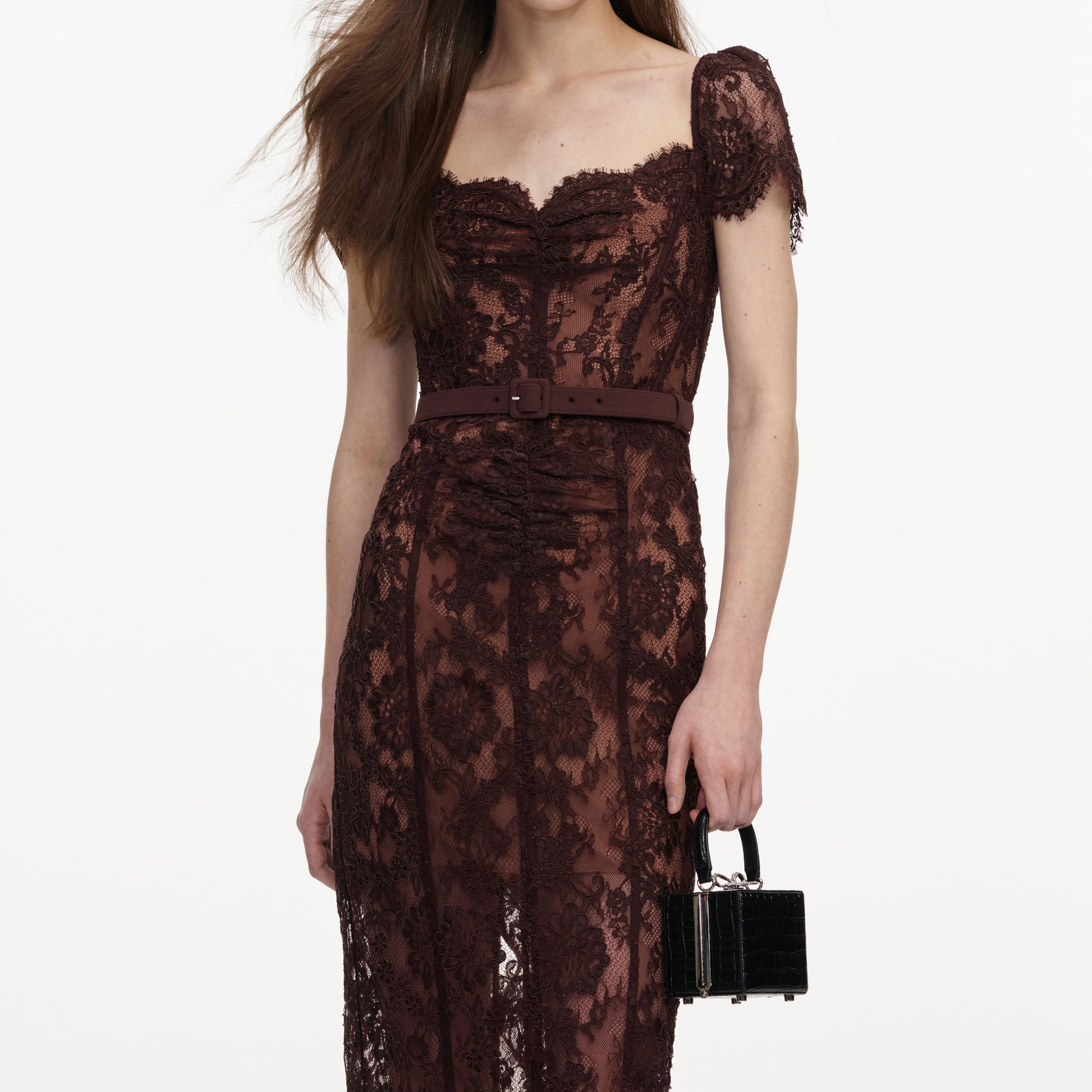 A close up of a woman wearing the Brown Floral Lace Midi Dress