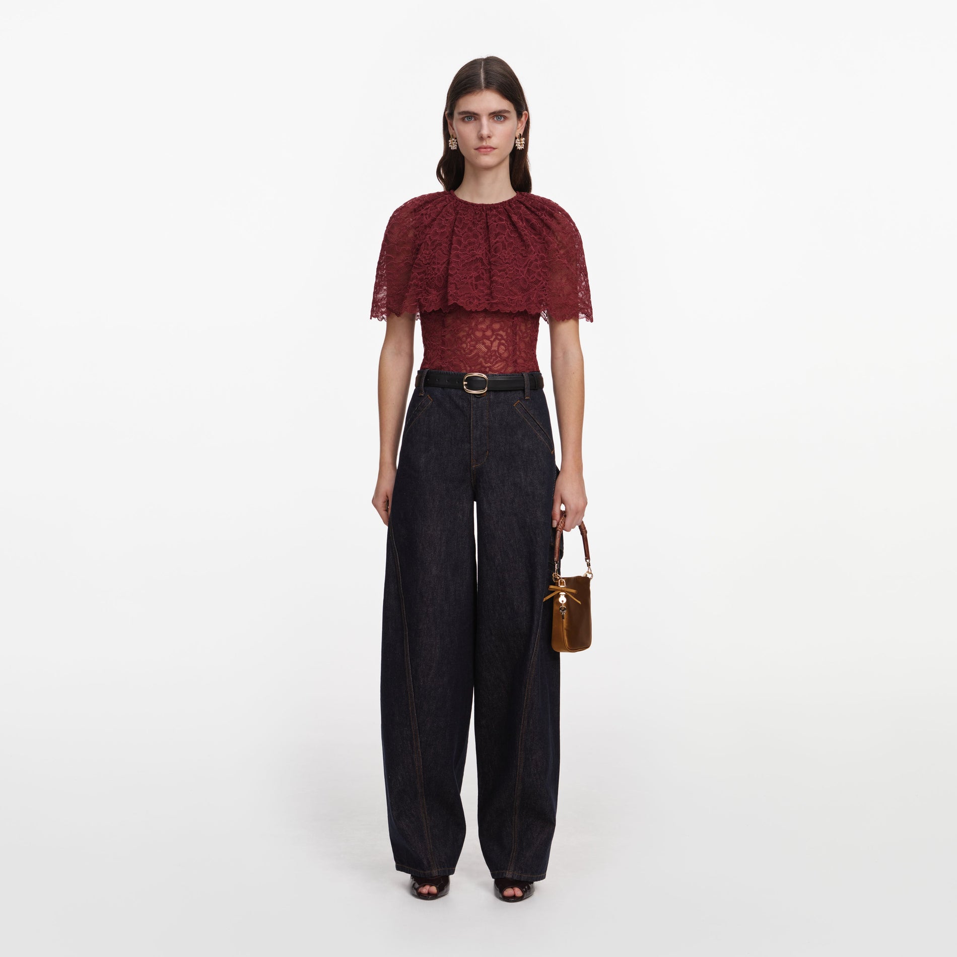 Front view of a woman wearing the Burgundy Lace Cape Top