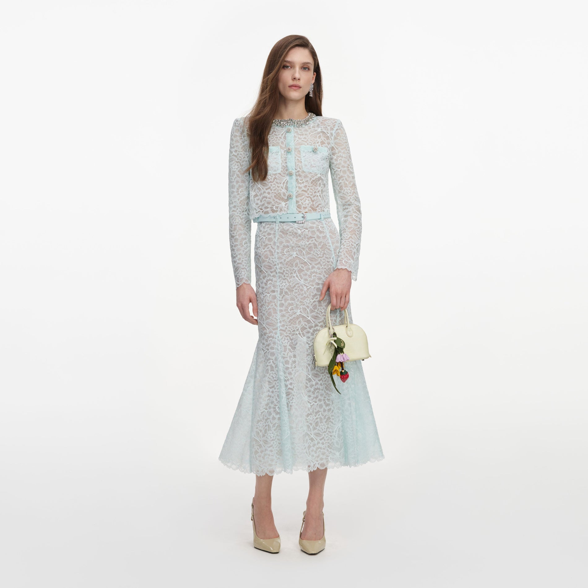 Front view of a woman wearing the Mint Lace Midi Skirt