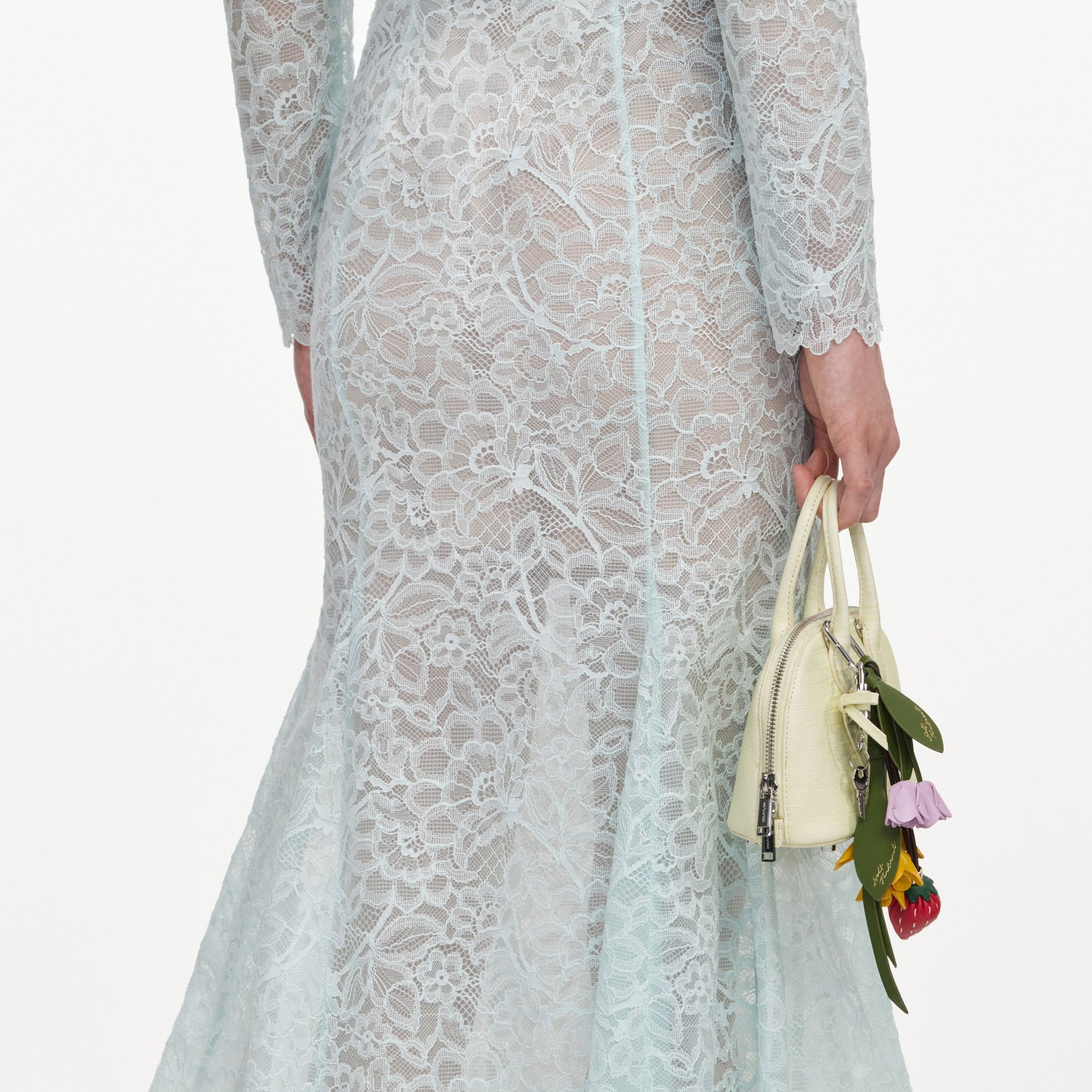 A close up of a woman wearing the Mint Lace Midi Skirt