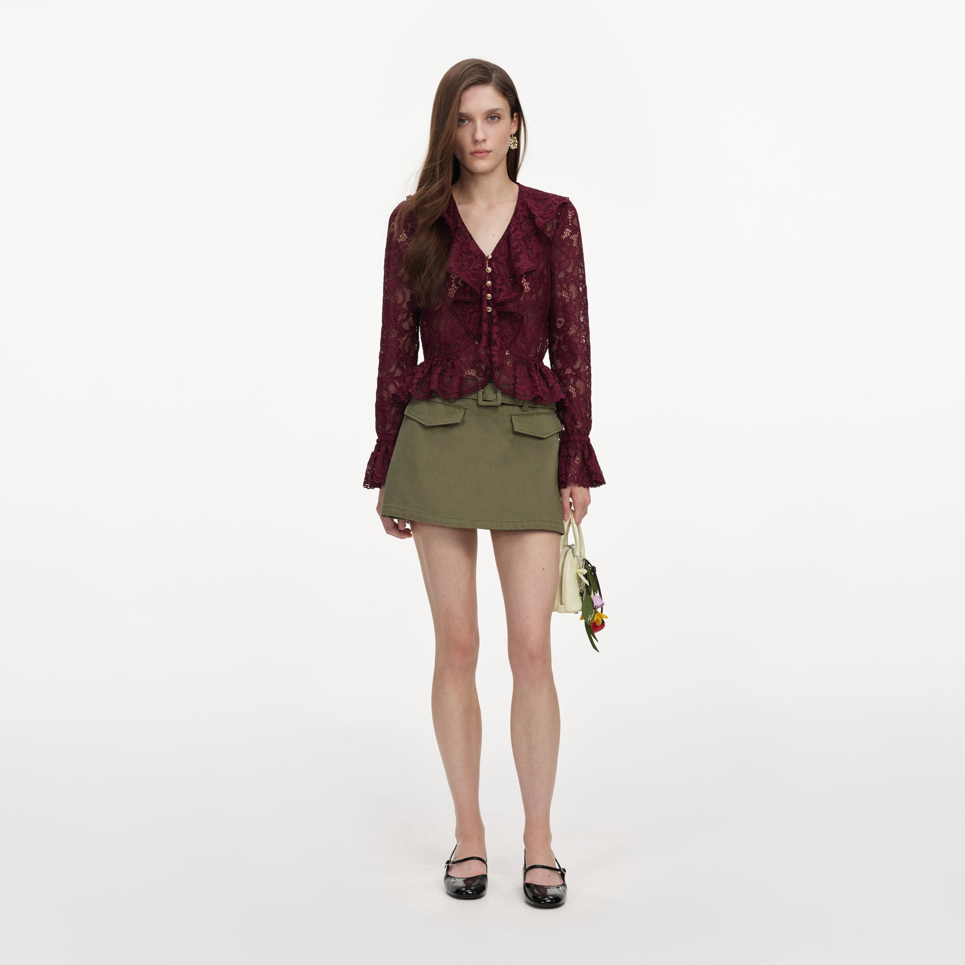 Front view of a woman wearing the Plum Lace Ruffle Top