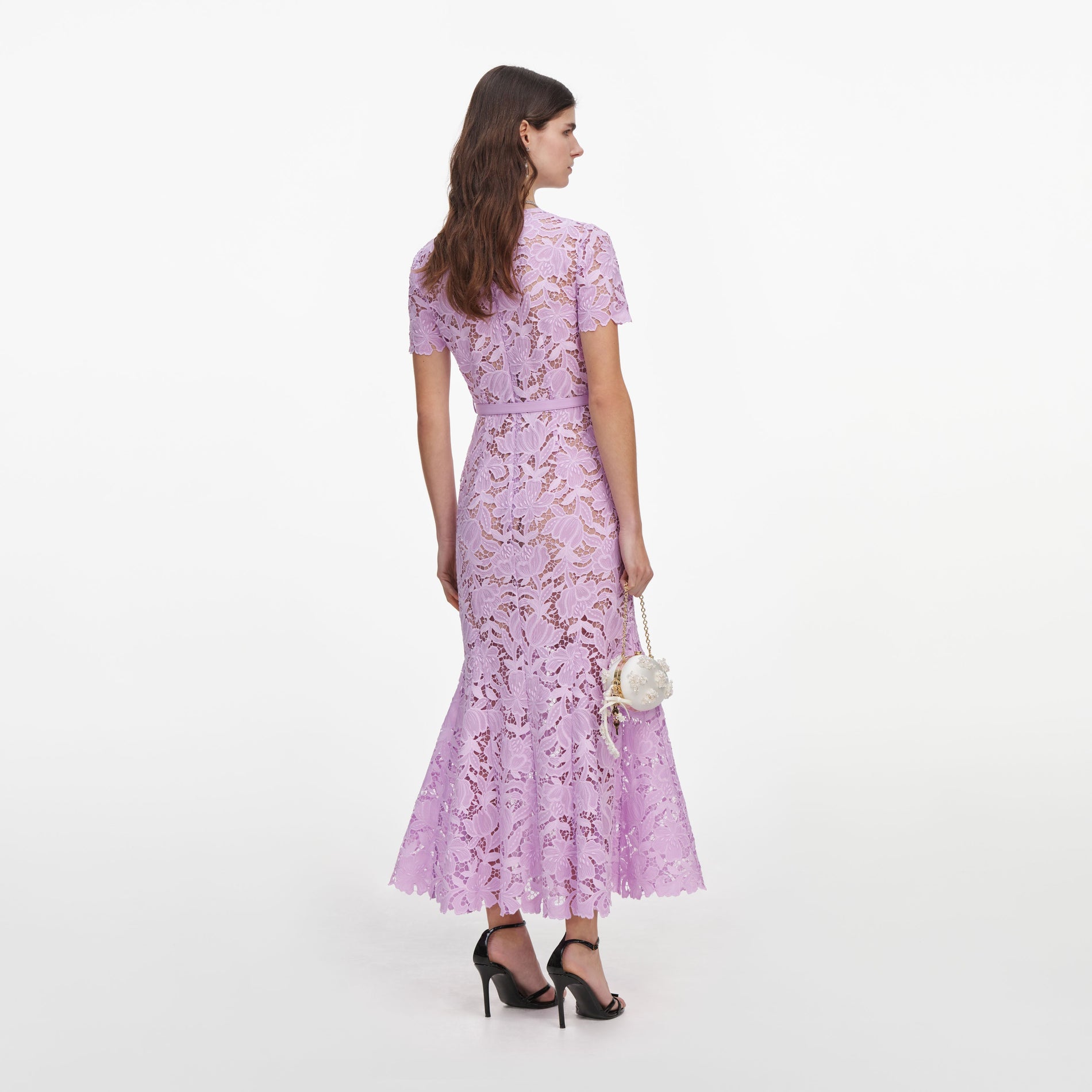 Back view of a woman wearing the Lilac Lace Midi Dress