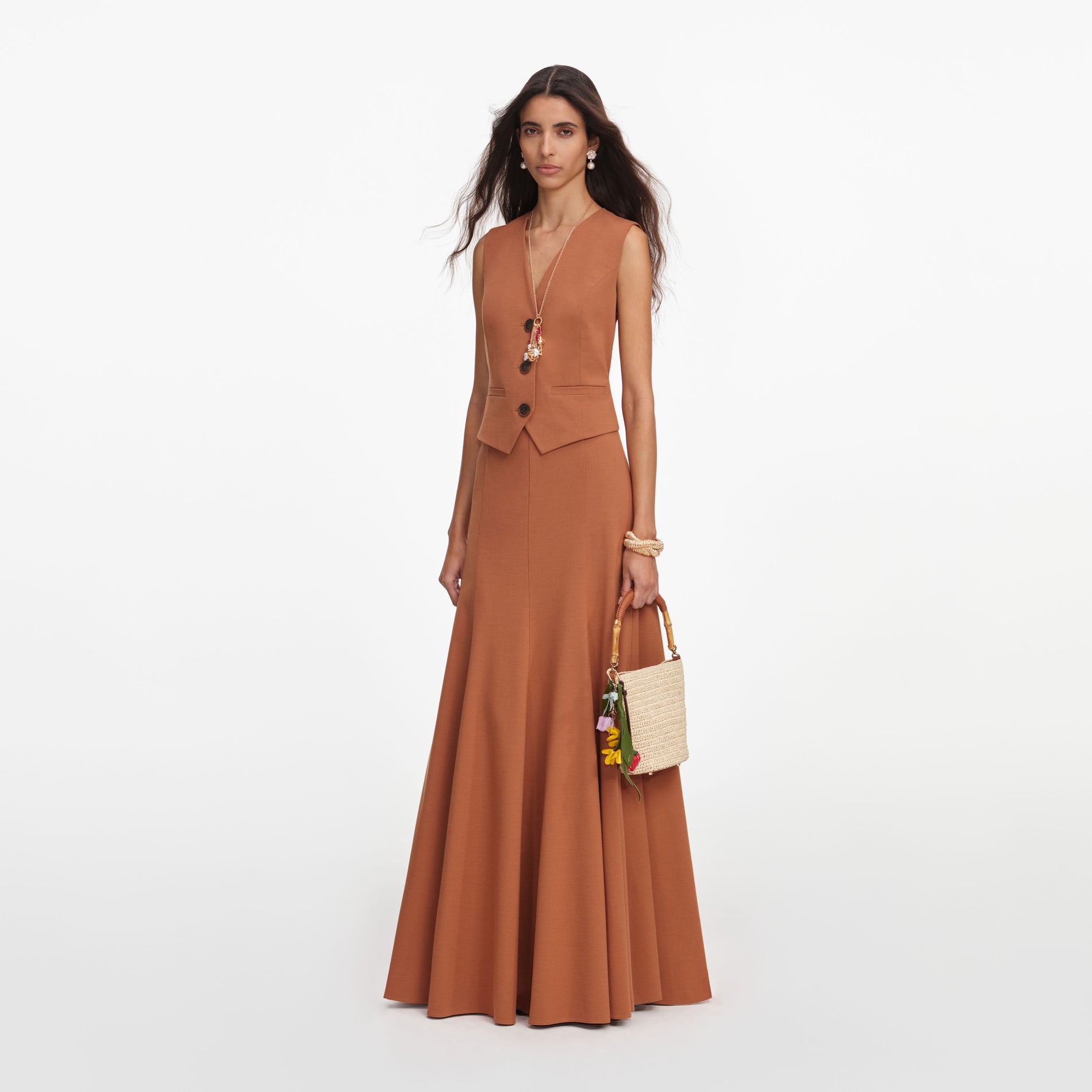 Side view of a woman wearing the Brown Twill Sleeveless Maxi Dress