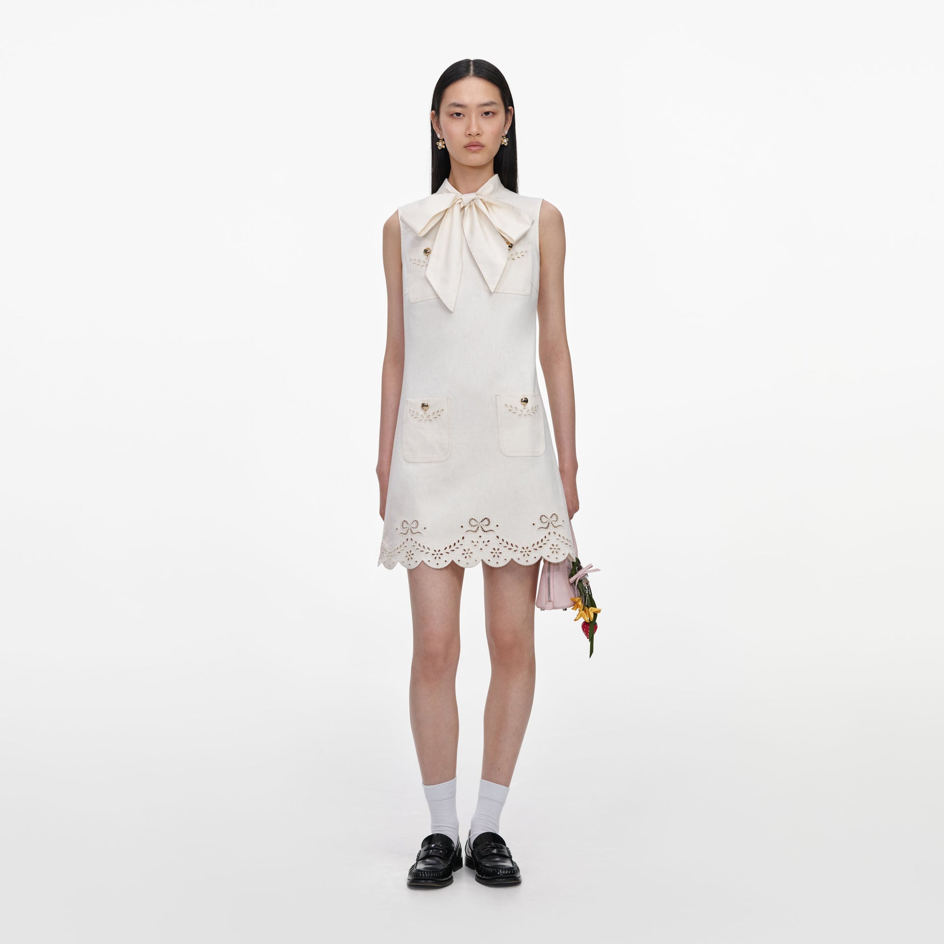 Front view of a woman wearing the Cream Broderie Denim Mini Dress