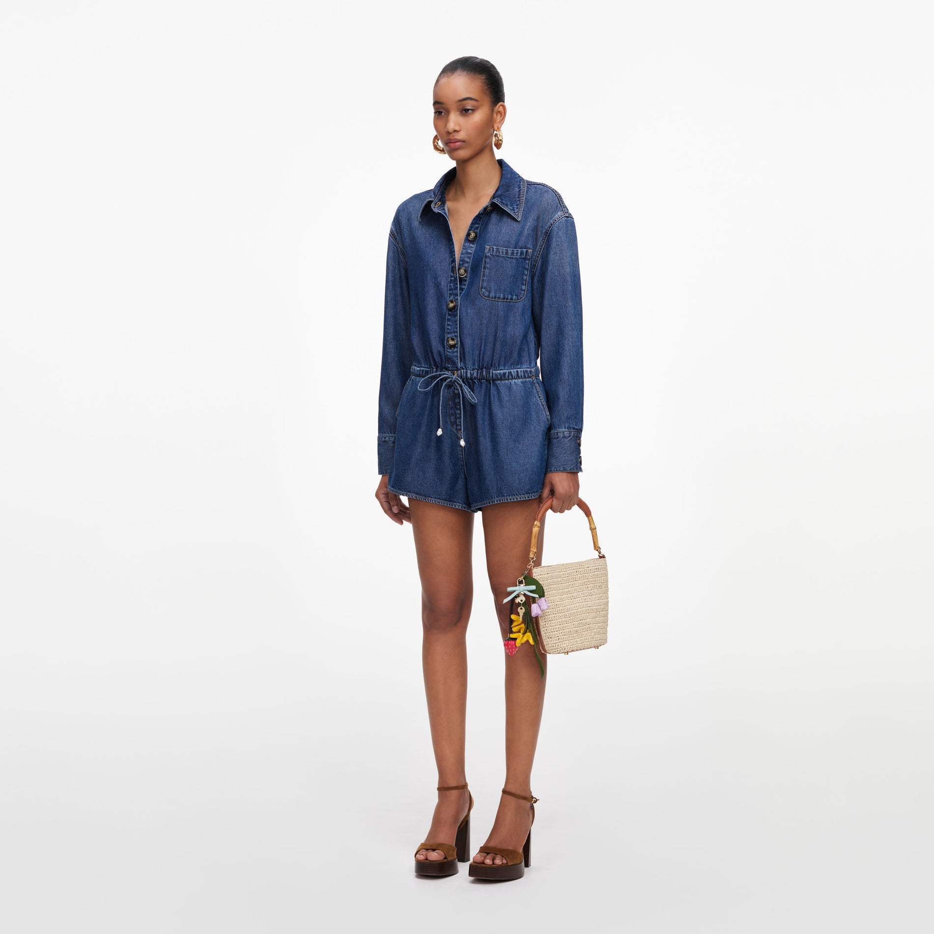 Side view of a woman wearing the Denim Relaxed Fit Playsuit