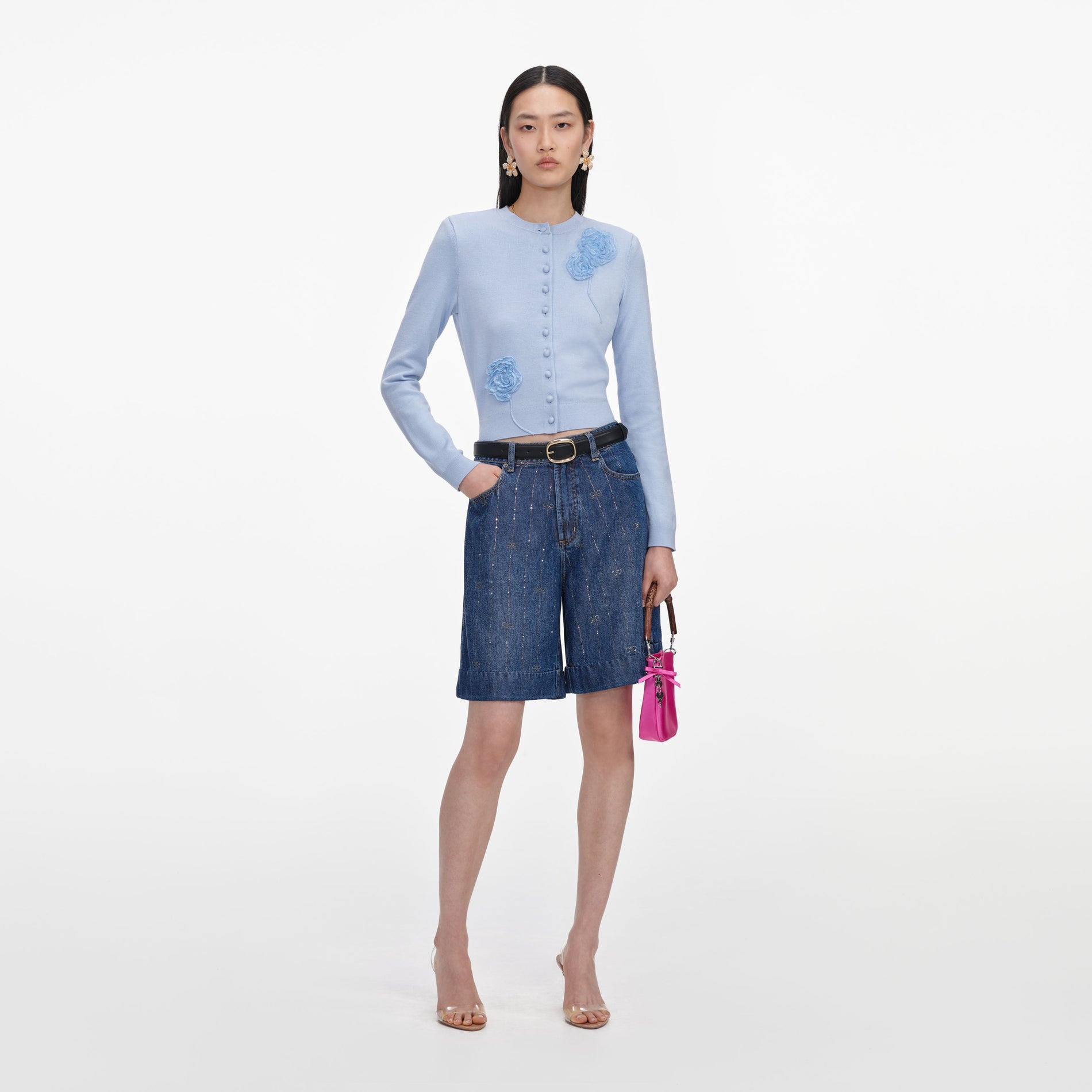 Front view of a woman wearing the Rhinestone Stripe Denim Shorts