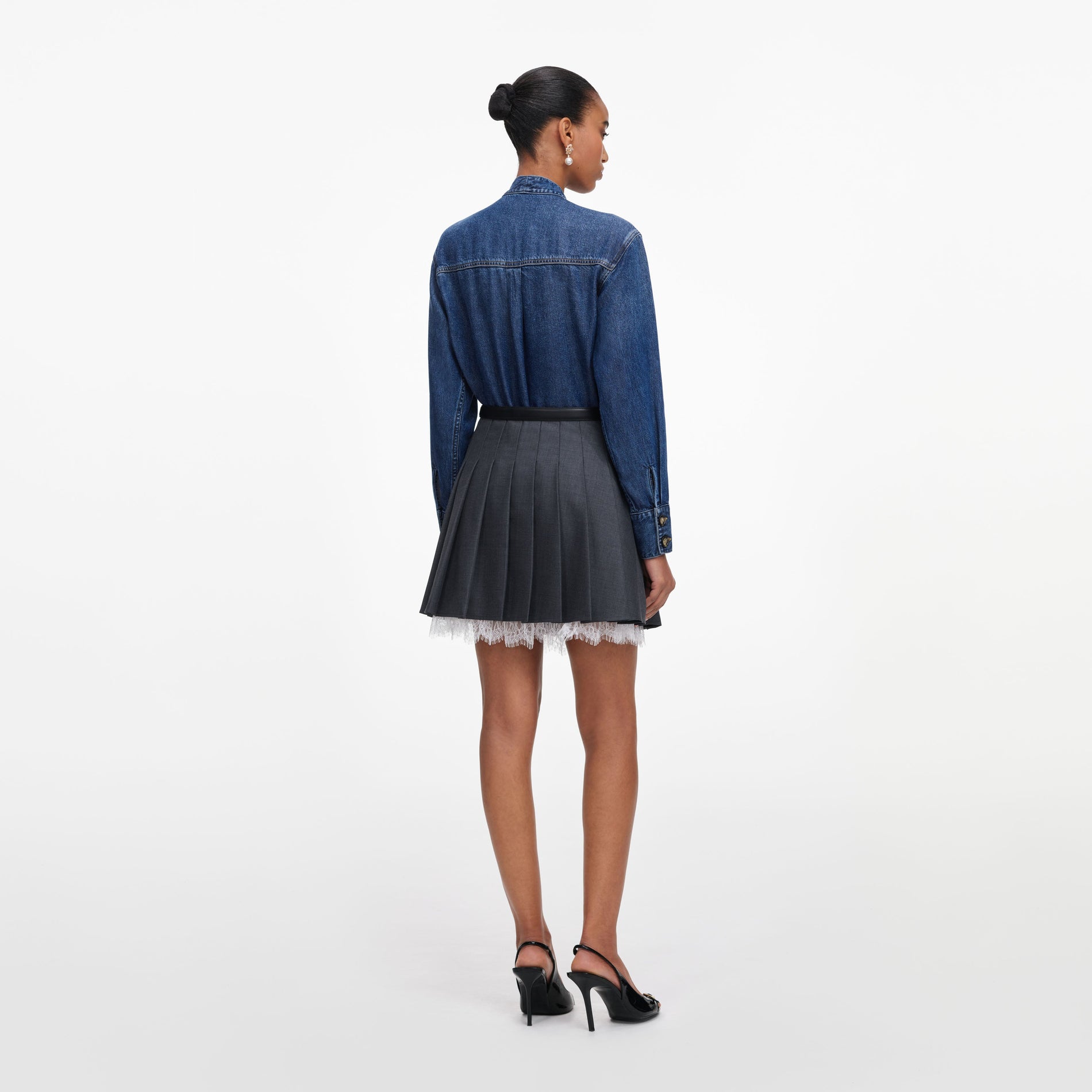 Back view of a woman wearing the Denim Tie Neck Shirt