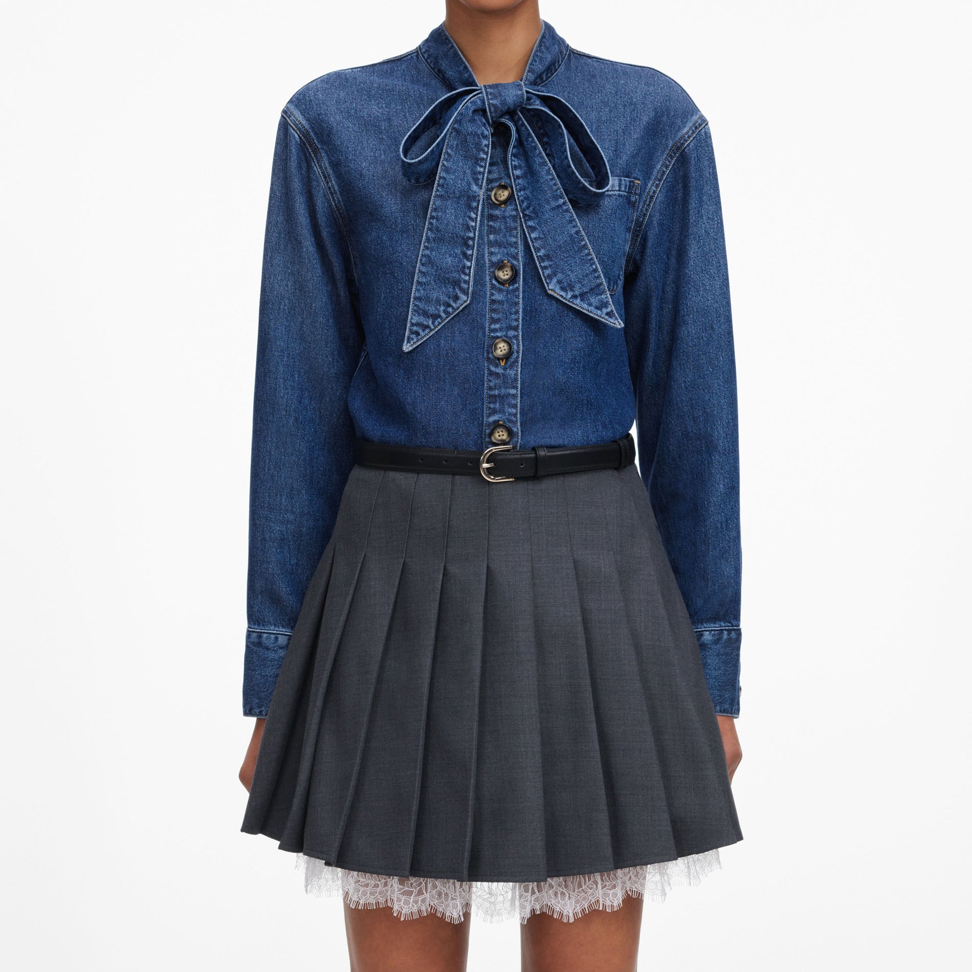 A close up of a woman wearing the Denim Tie Neck Shirt