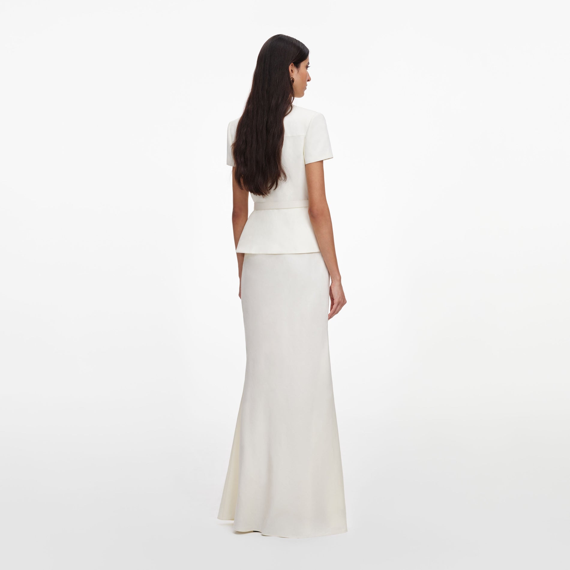 Back view of a woman wearing the Cream Linen Blend Peplum Maxi Dress