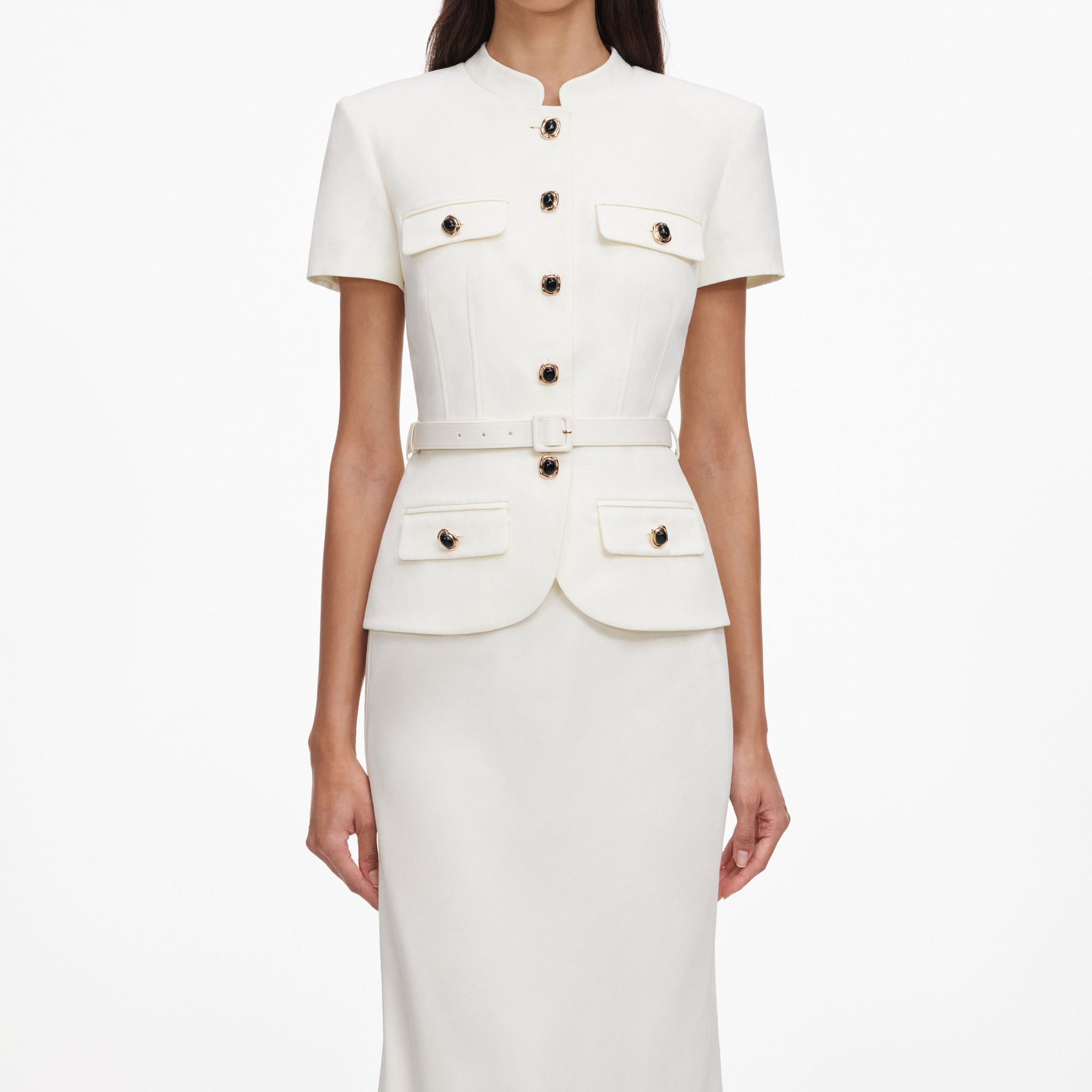 A close up of a woman wearing the Cream Linen Blend Peplum Maxi Dress