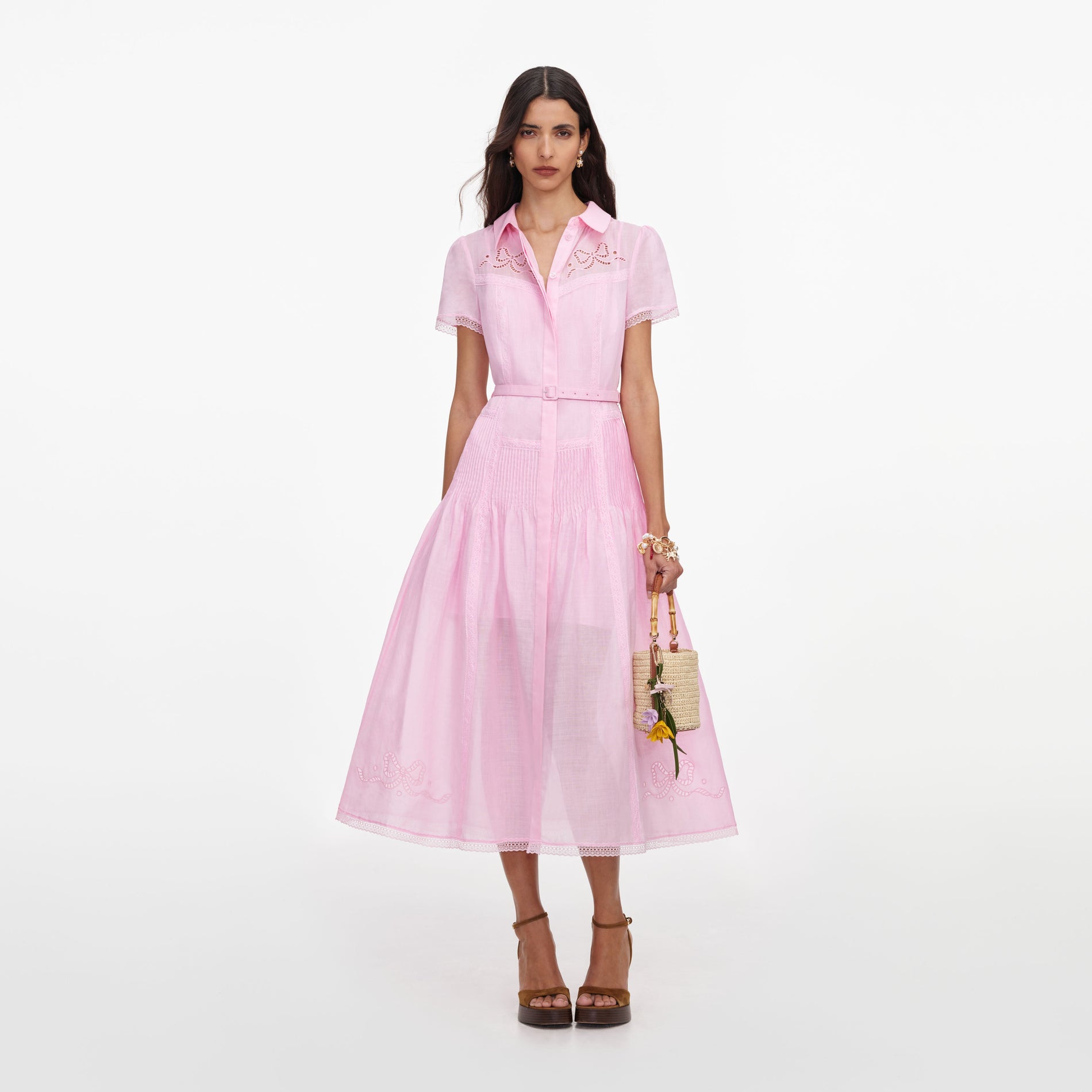 Front view of a woman wearing the Pink Embroidered Midi Dress