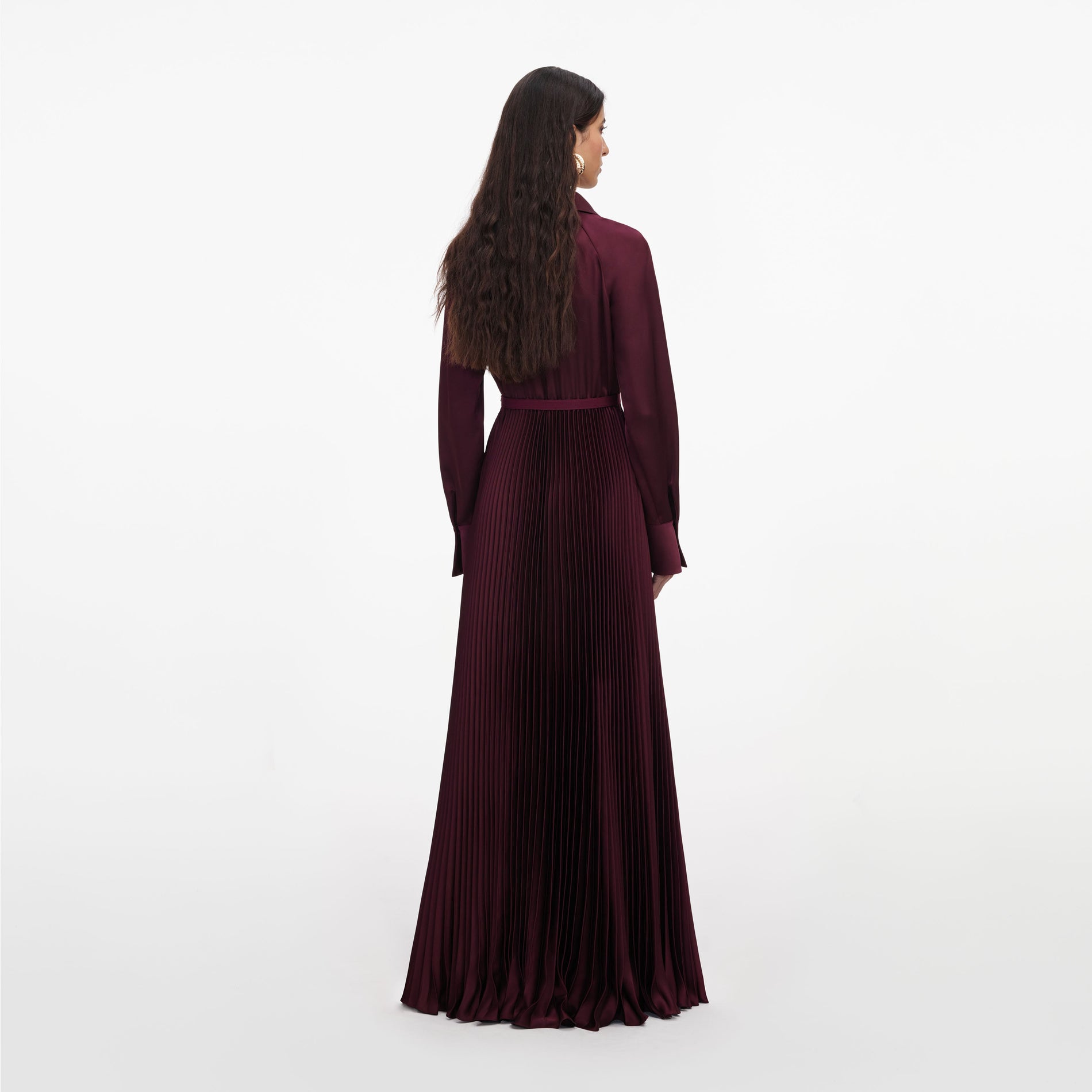 Back view of a woman wearing the Plum Satin Pleated Maxi Dress