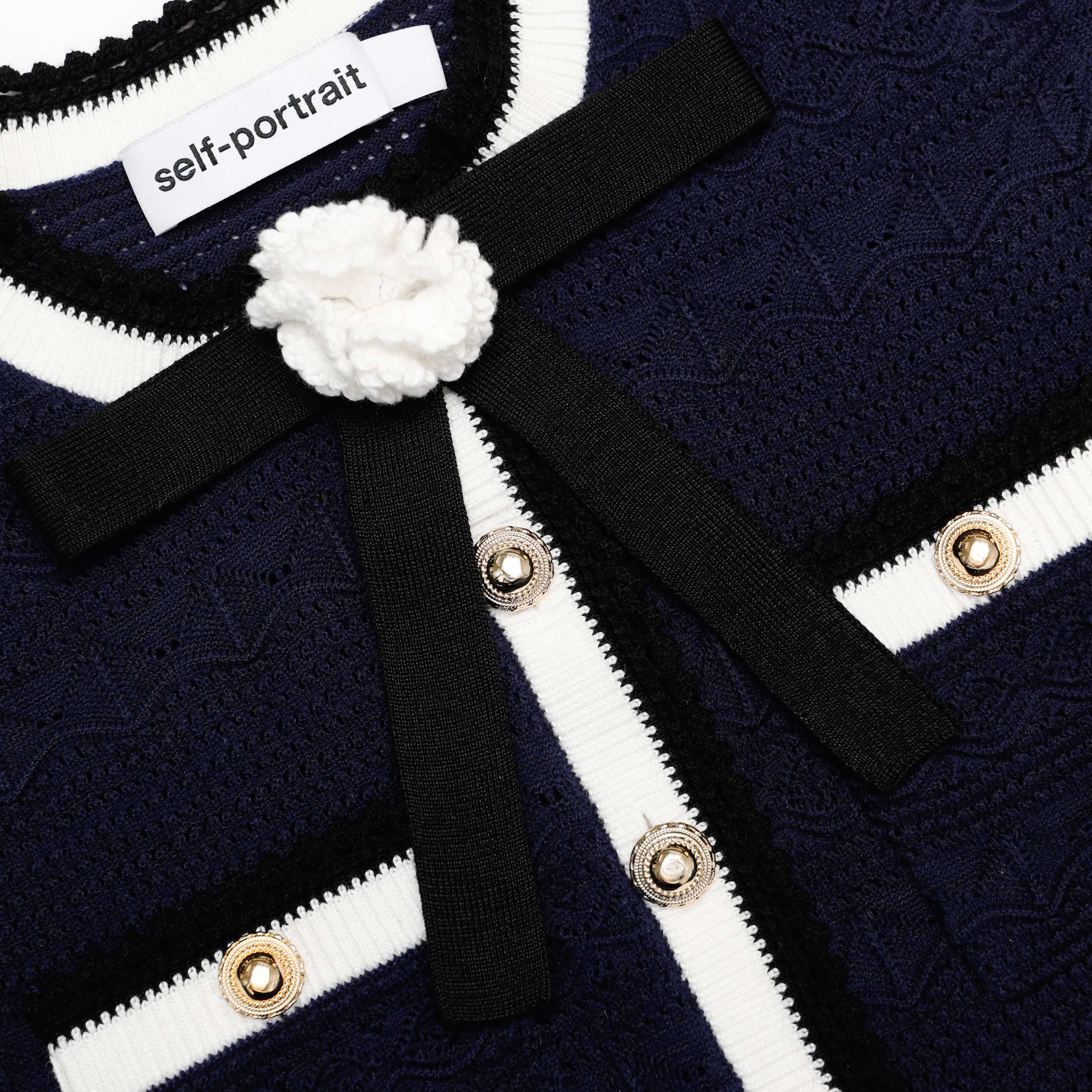 Navy Peplum Pointelle Knit Top