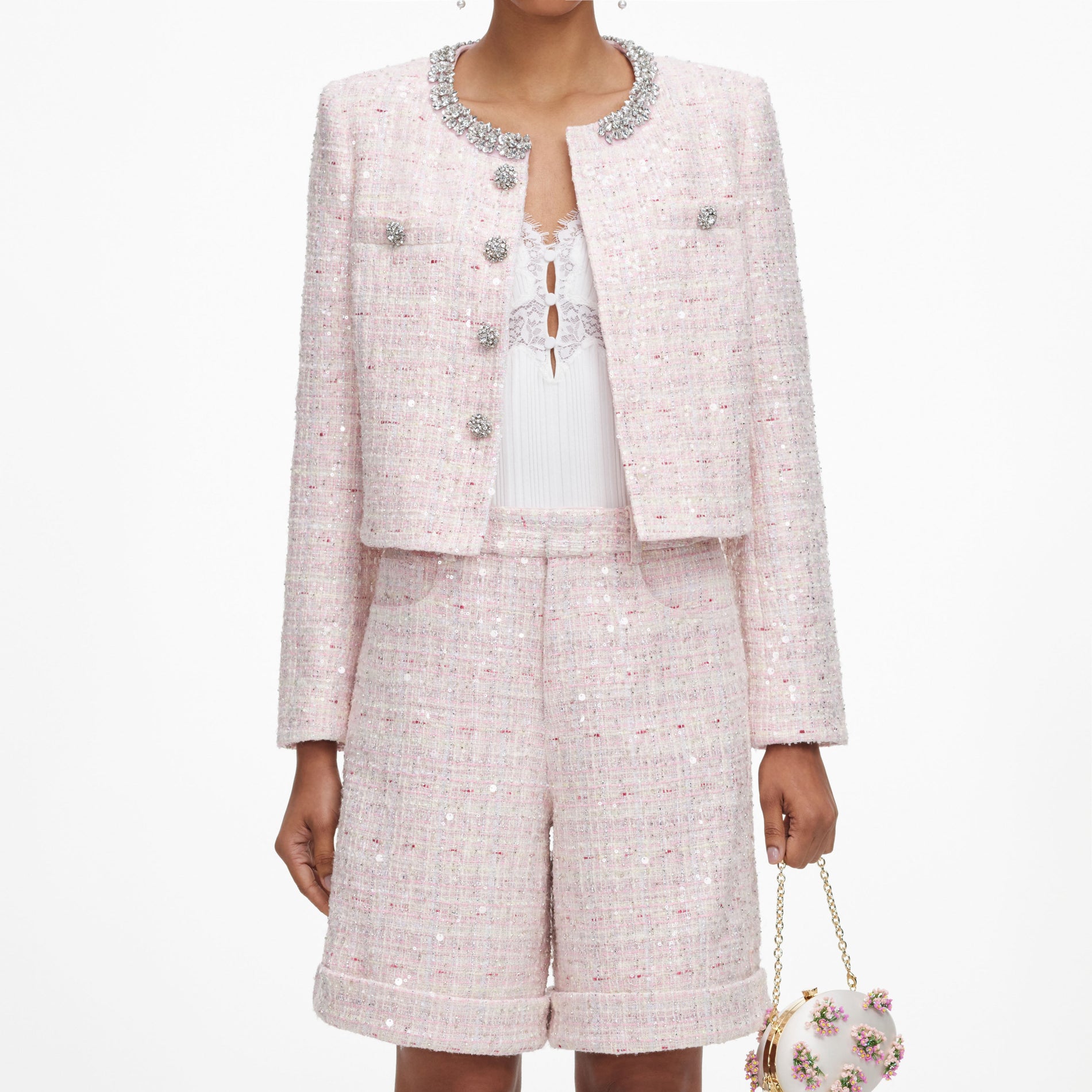 A close up of a woman wearing the Pink Sequin Boucle Shorts