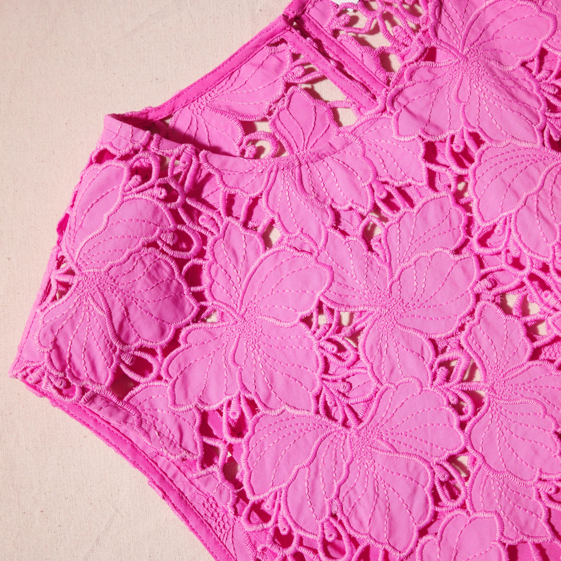 A close up of the fabric for the Pink Cotton Lace Mini Dress