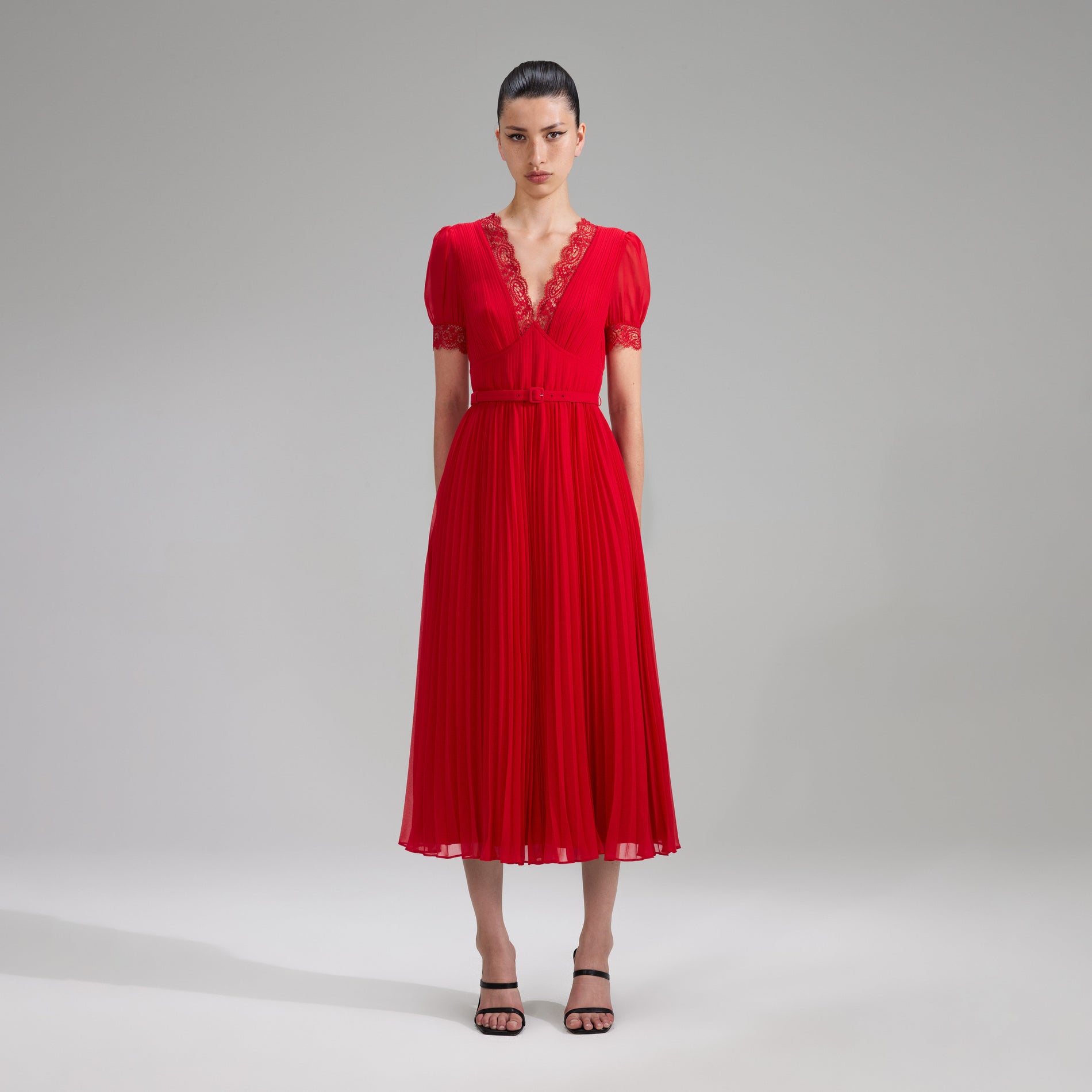 A woman wearing the Red Chiffon Midi Dress Lace Detail