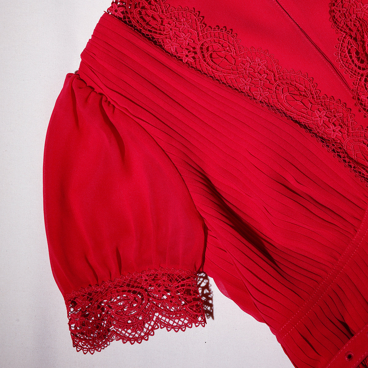 A close up of the fabric for the Red Chiffon Midi Dress Lace Detail