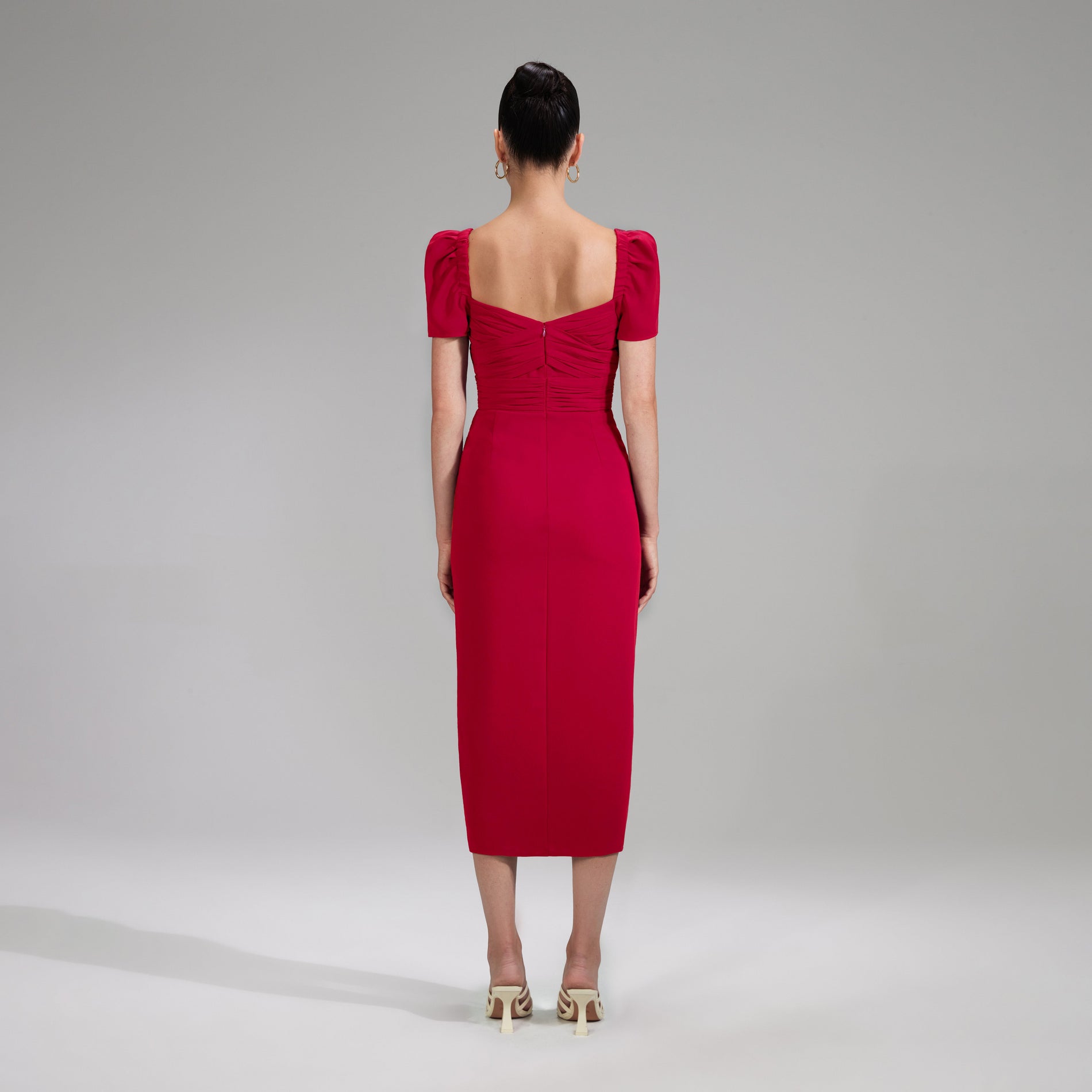 A woman wearing the Red Iris Midi Dress