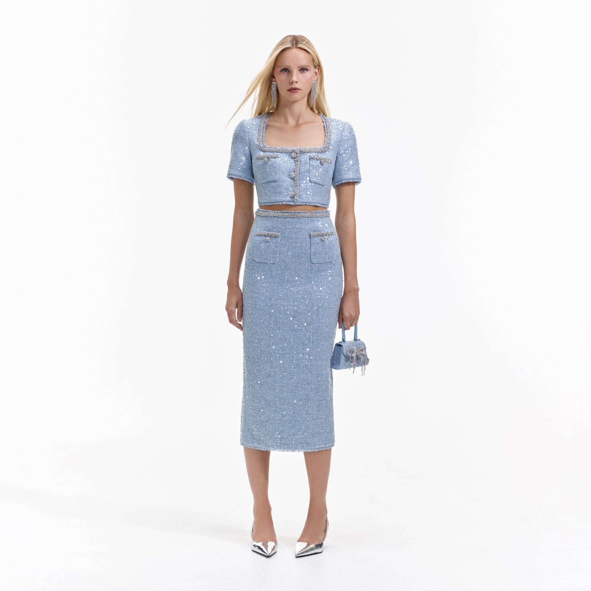 Front view of a woman wearing the Blue Sequin Boucle Midi Skirt