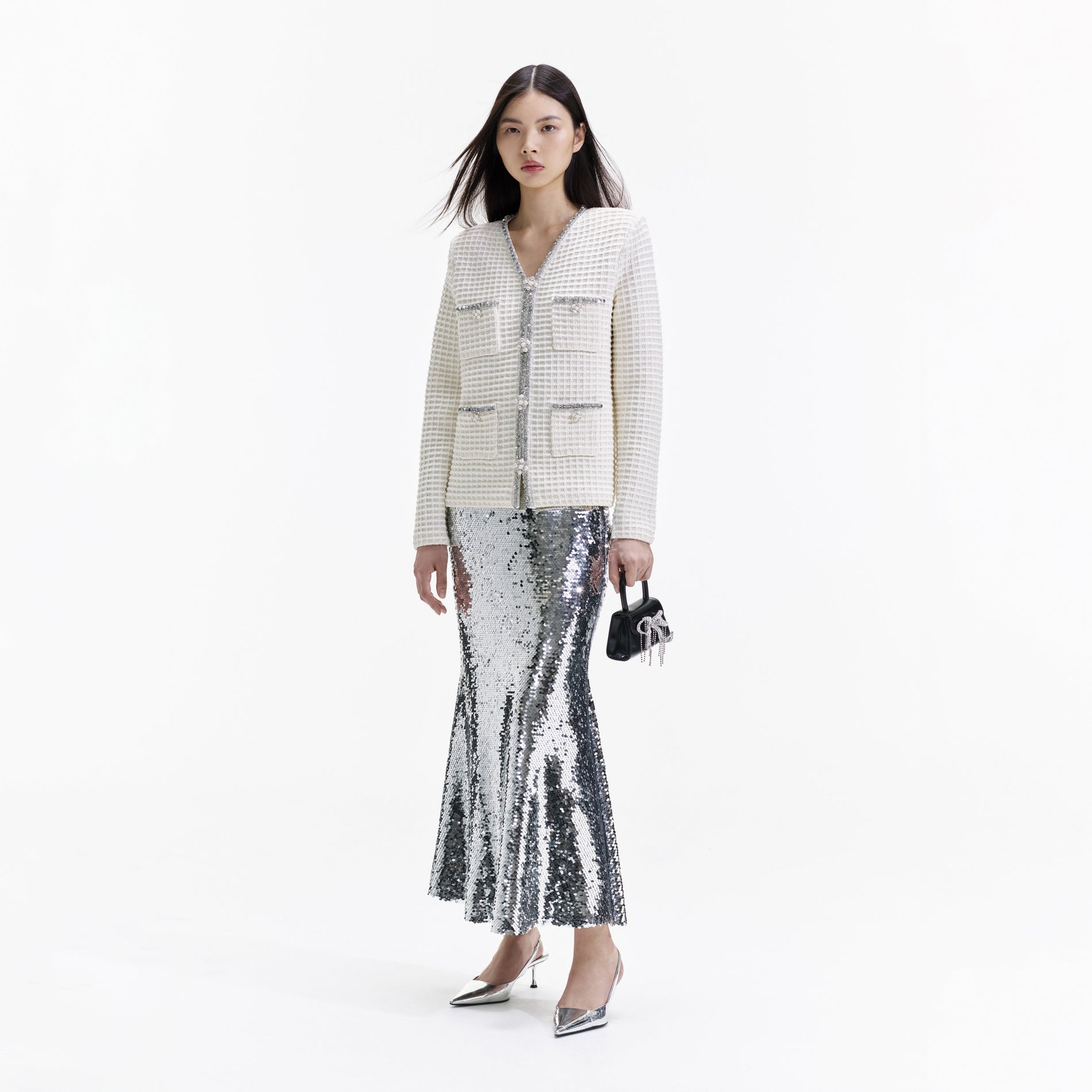 Side view of a woman wearing the Cream Knit Cardigan