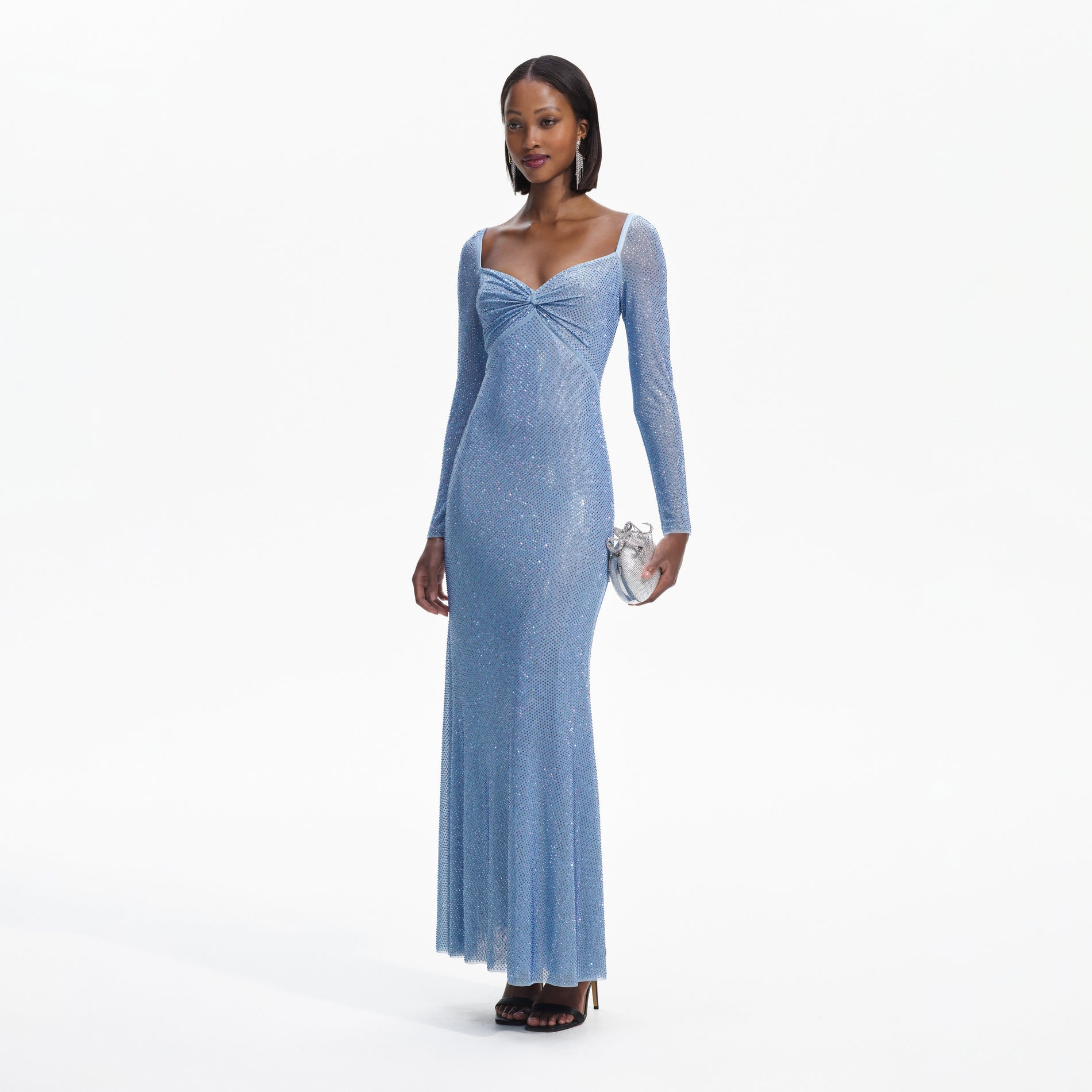 Side view of a woman wearing the Blue Iridescent Rhinestone Maxi Dress