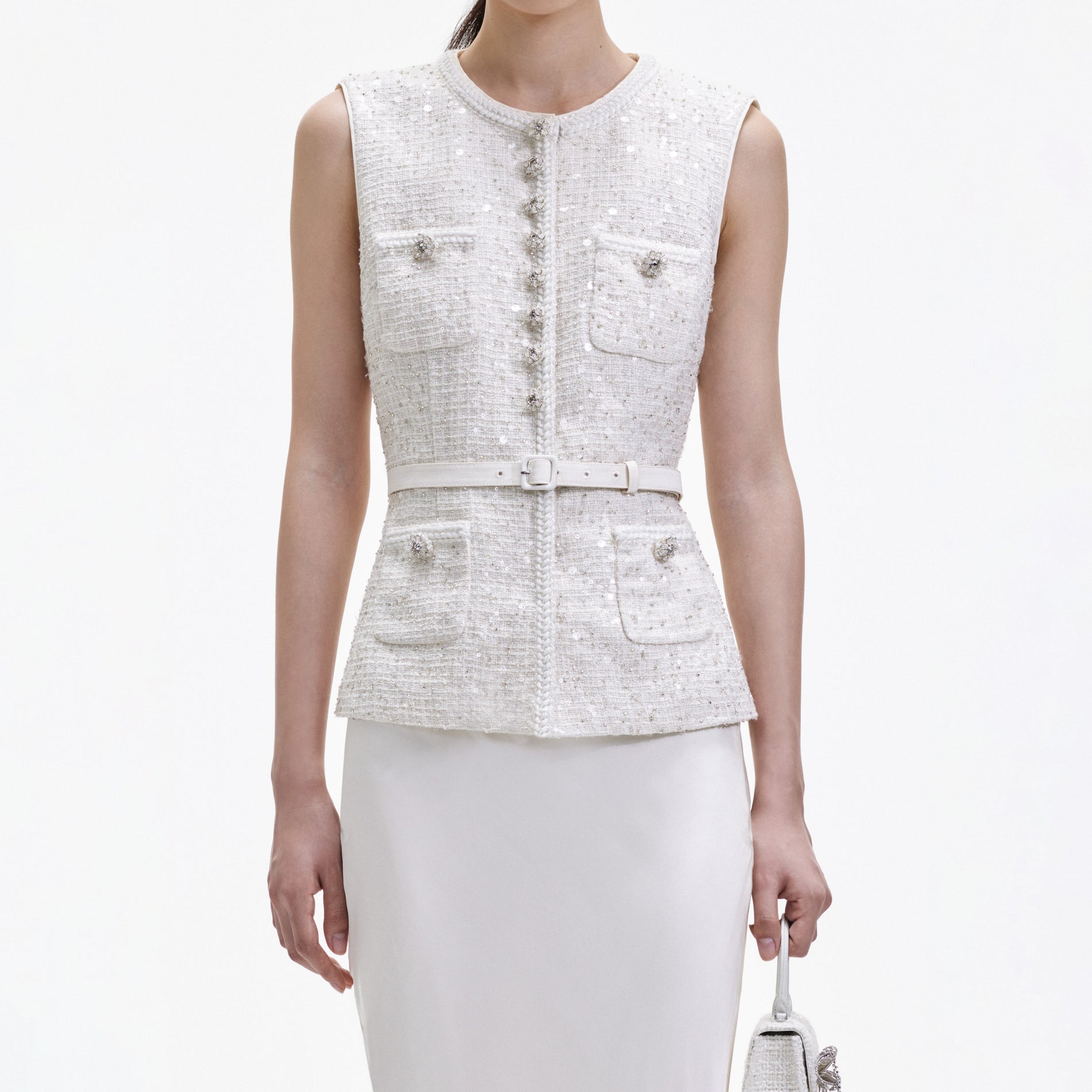 A close up of a woman wearing the Cream Sequin Boucle Maxi Dress