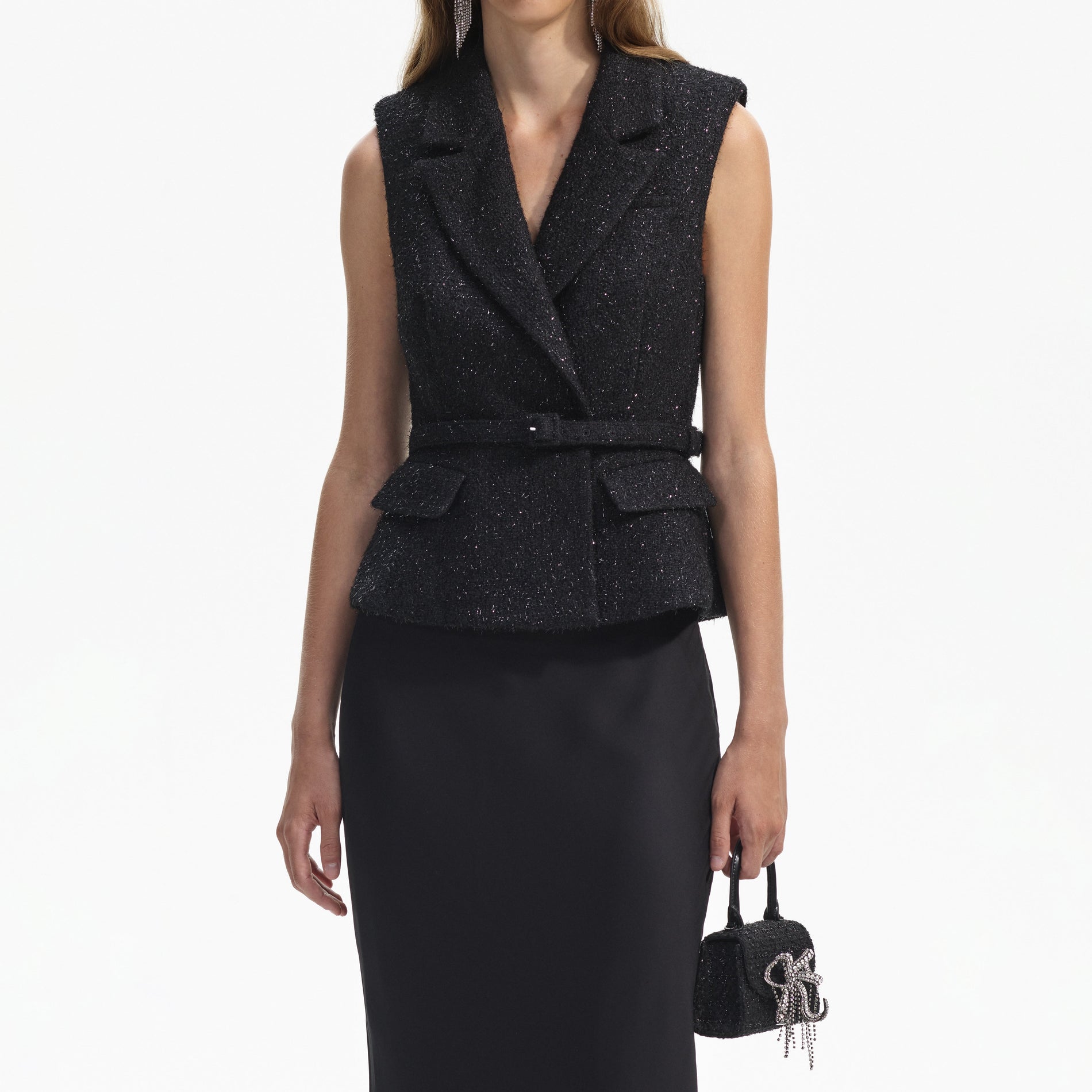 A close up of a woman wearing the Black Boucle Maxi Dress