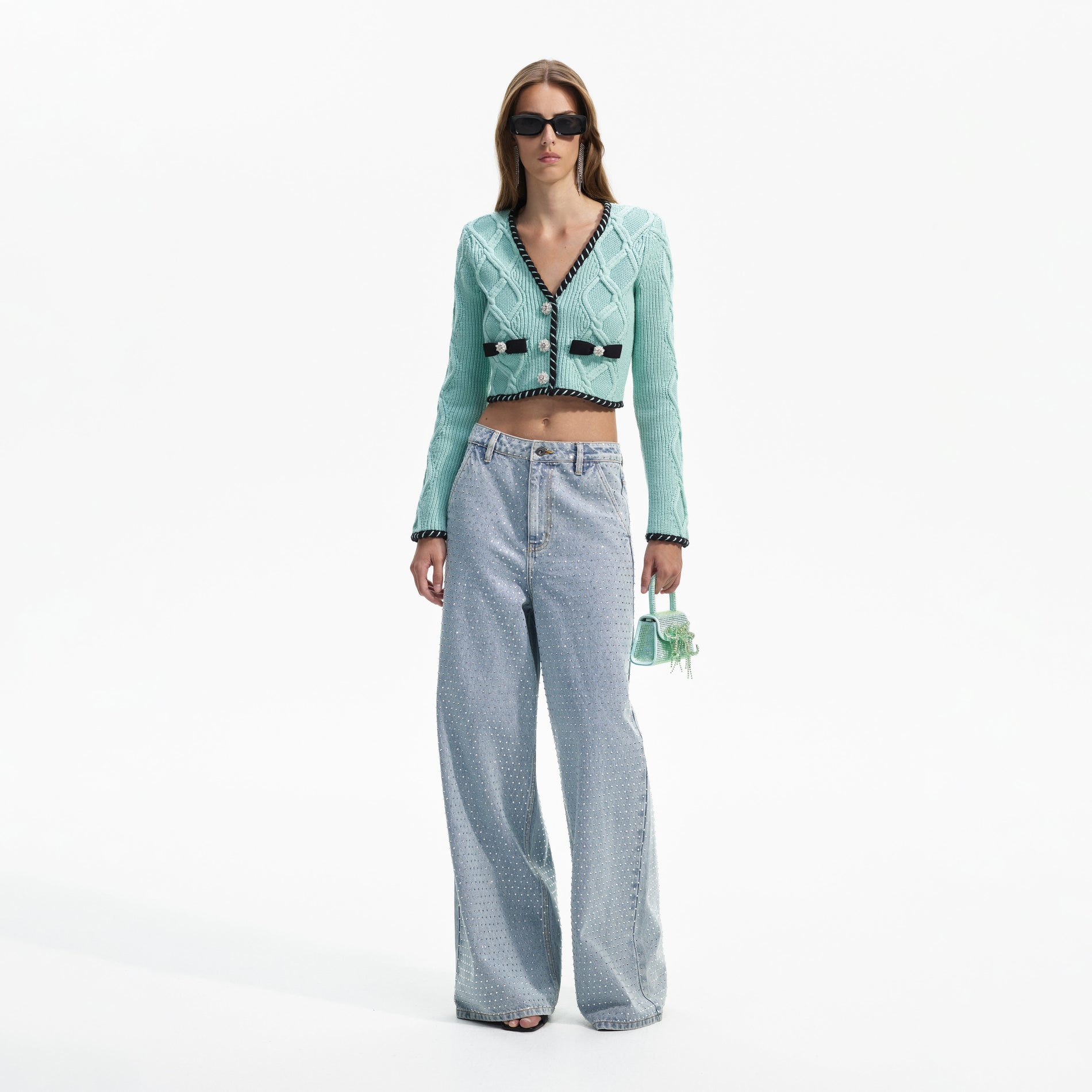 Front view of a woman wearing the Mint Cable Knit Cropped Cardigan