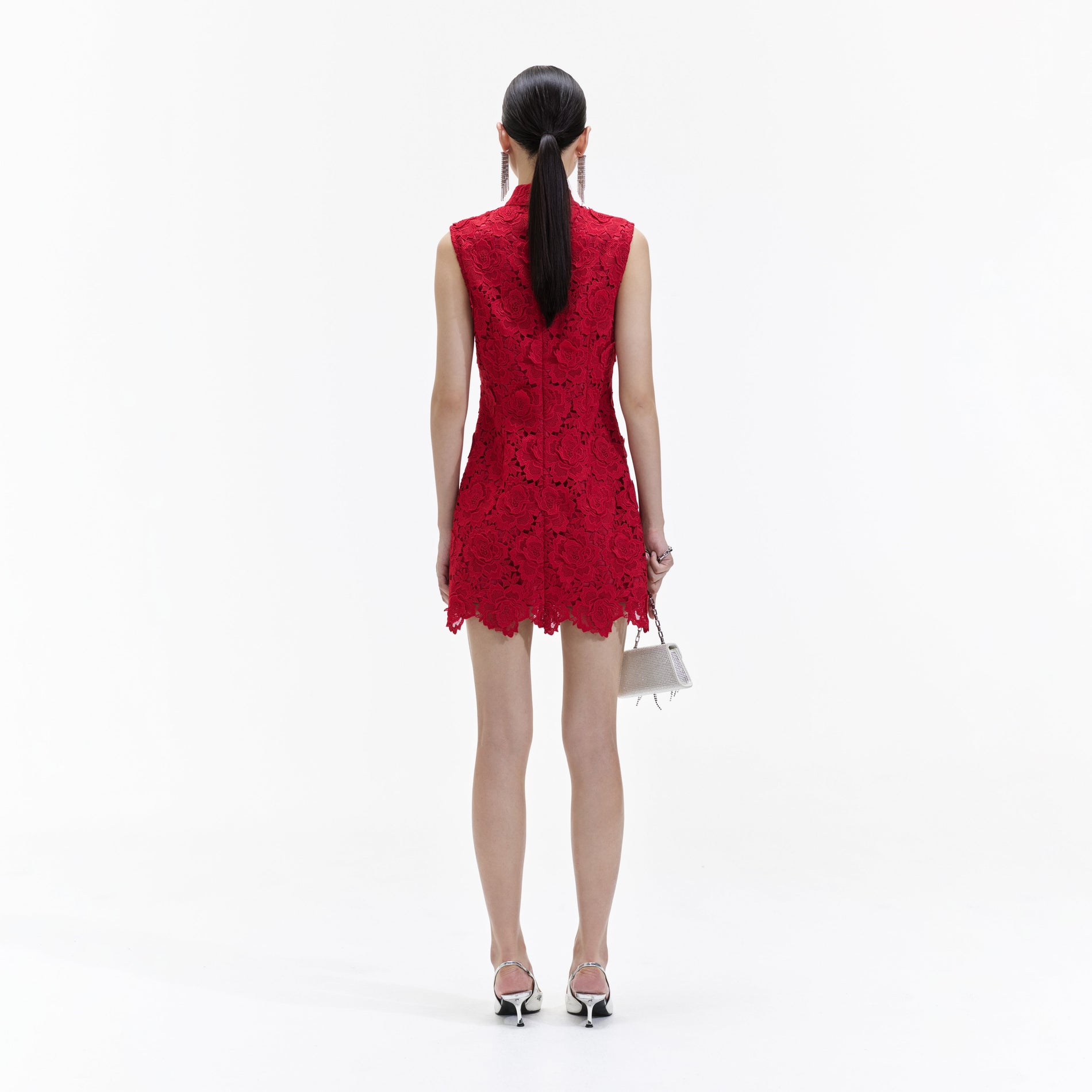 Back view of a woman wearing the Red Flower Lace Mini Dress