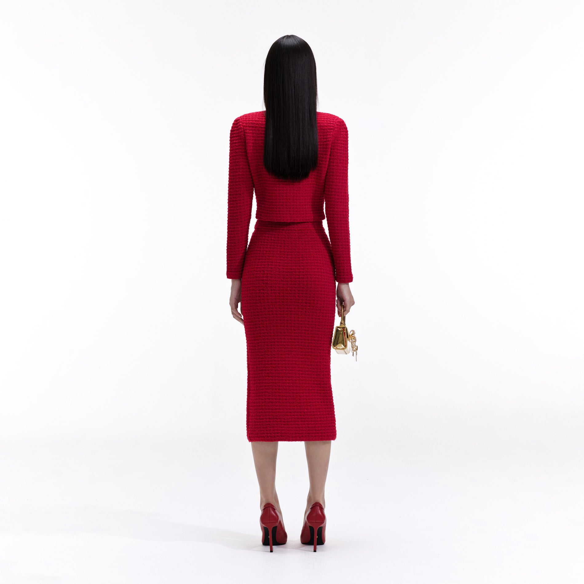 Back view of a woman wearing the Red Knit Midi Skirt