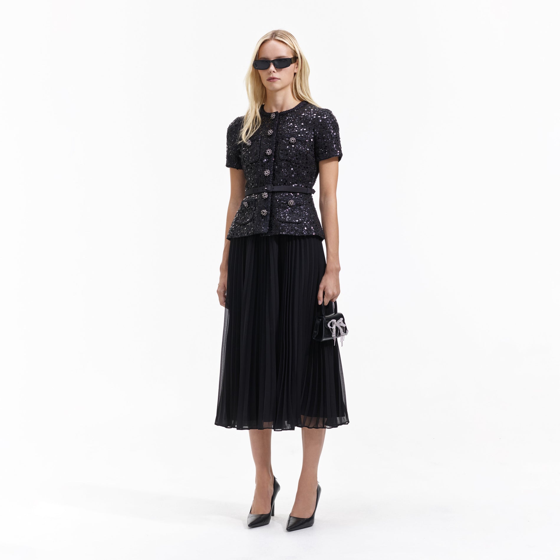 Side view of a woman wearing the Black Sequin Boucle Tailored Midi Dress