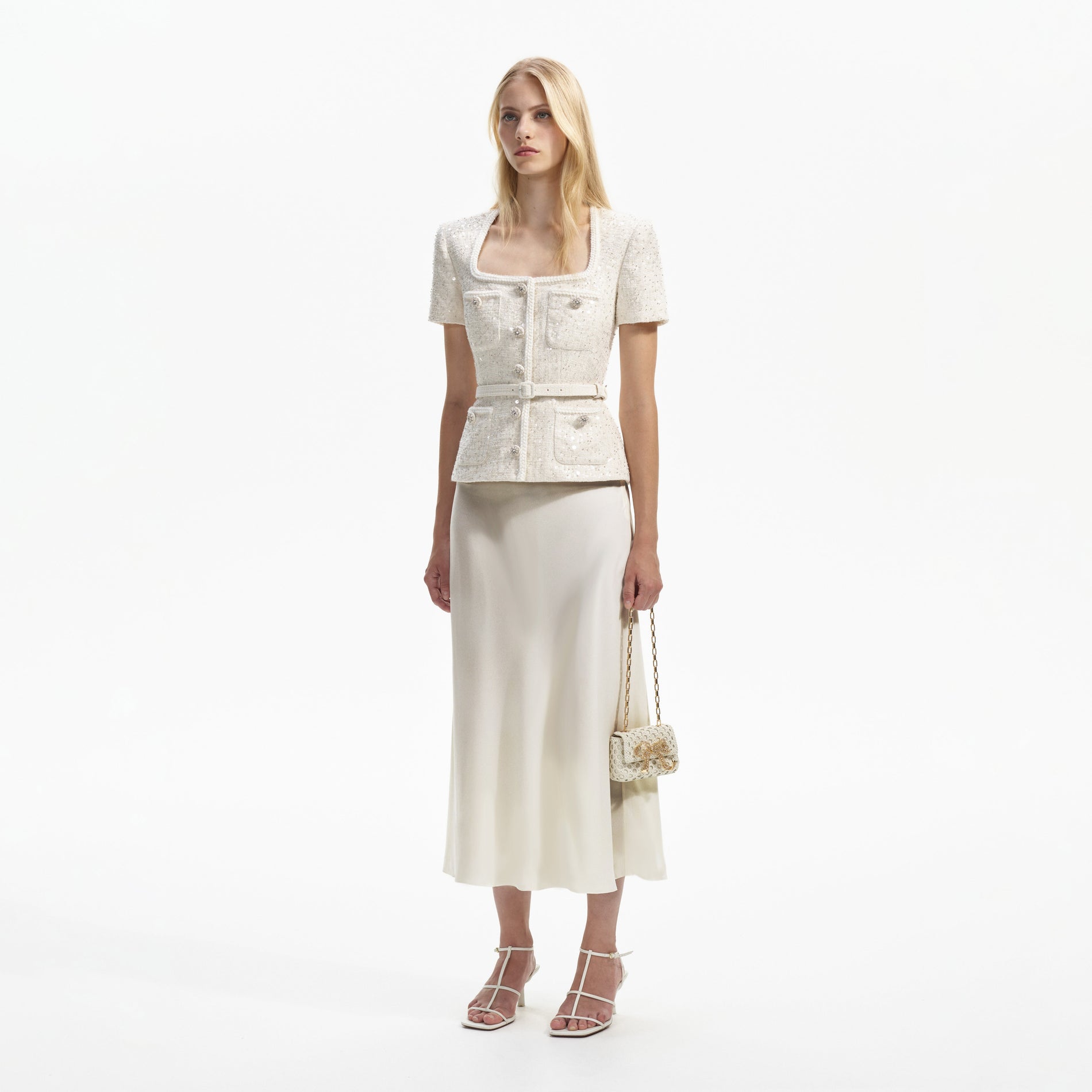 Side view of a woman wearing the Cream Sequin Boucle Midi Dress