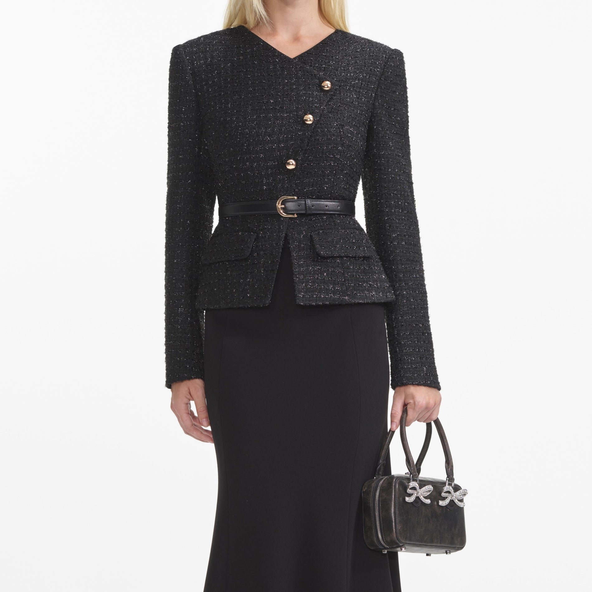 A close up of a woman wearing the Black Boucle Asymmetric Midi Dress