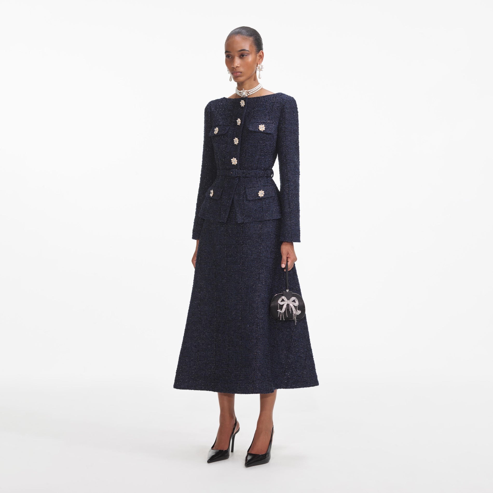 Side view of a woman wearing the Navy Metallic Boucle Midi Dress