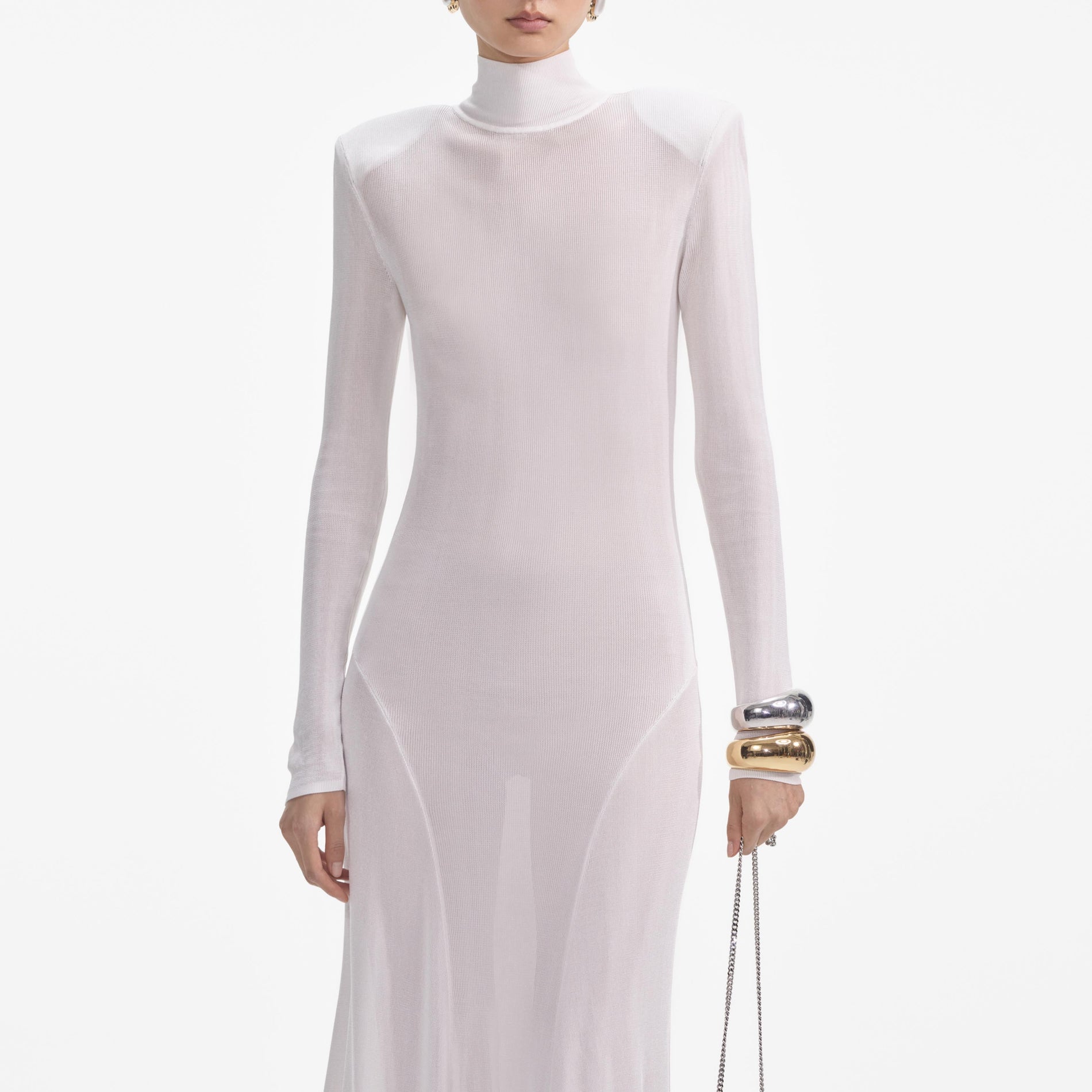 A close up of a woman wearing the White Viscose Knit Maxi Dress