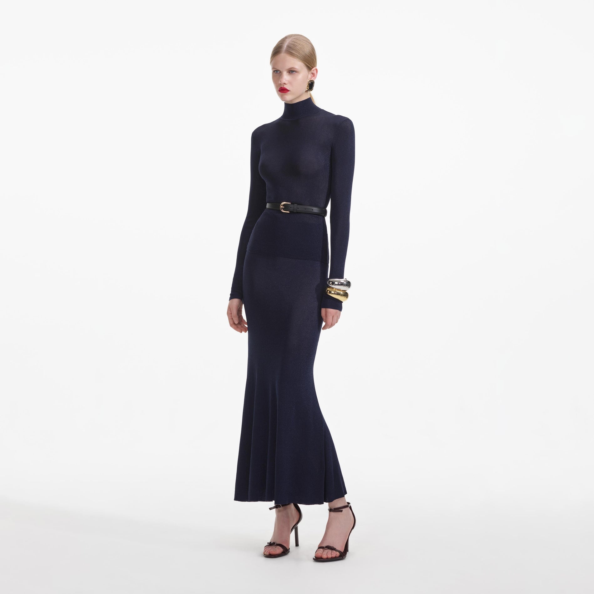 Side view of a woman wearing the Navy Viscose Knit Maxi Skirt