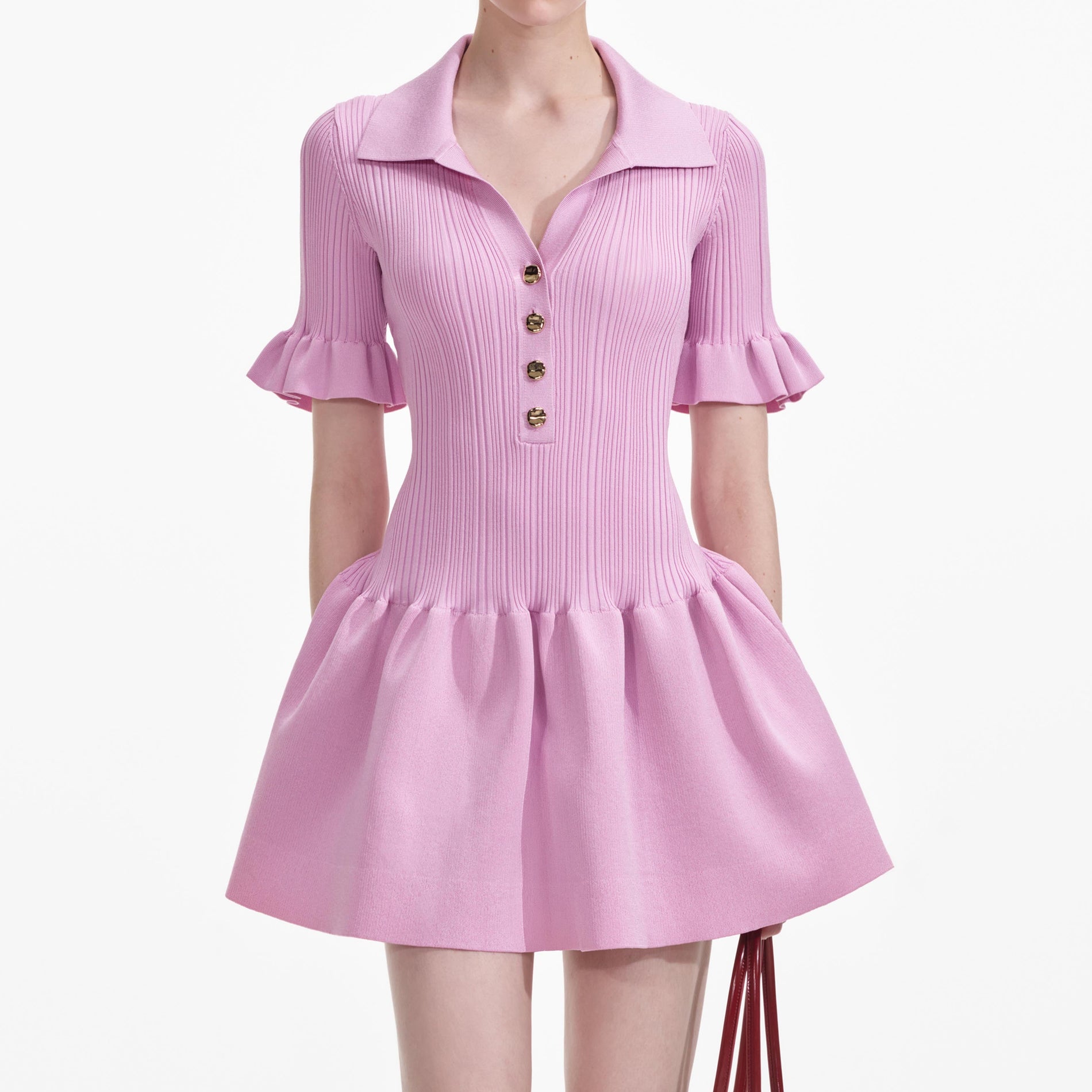 A close up of a woman wearing the Pink Viscose Rib Mini Dress