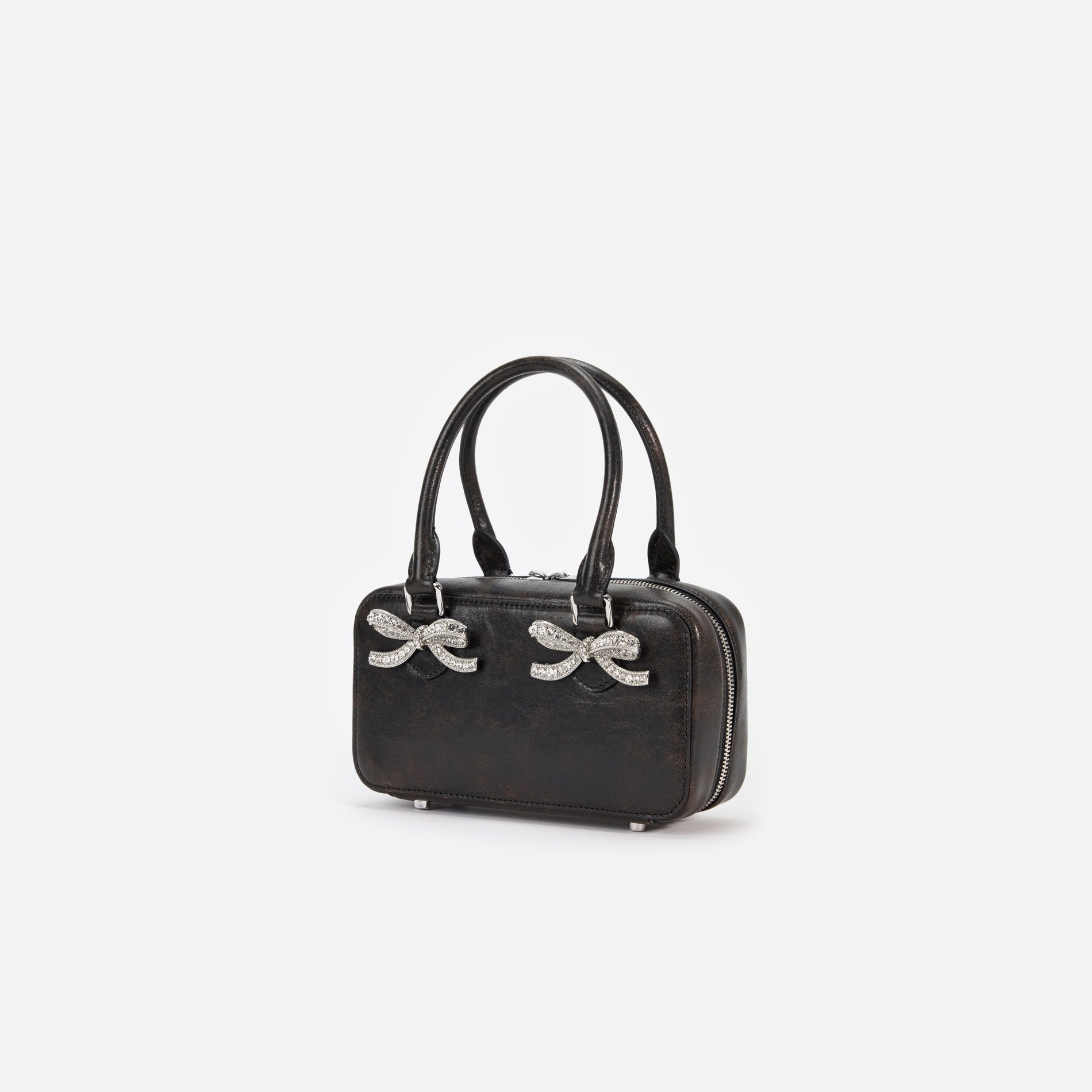 Side view of a woman wearing the Black Distressed Leather Mini Tote Bag