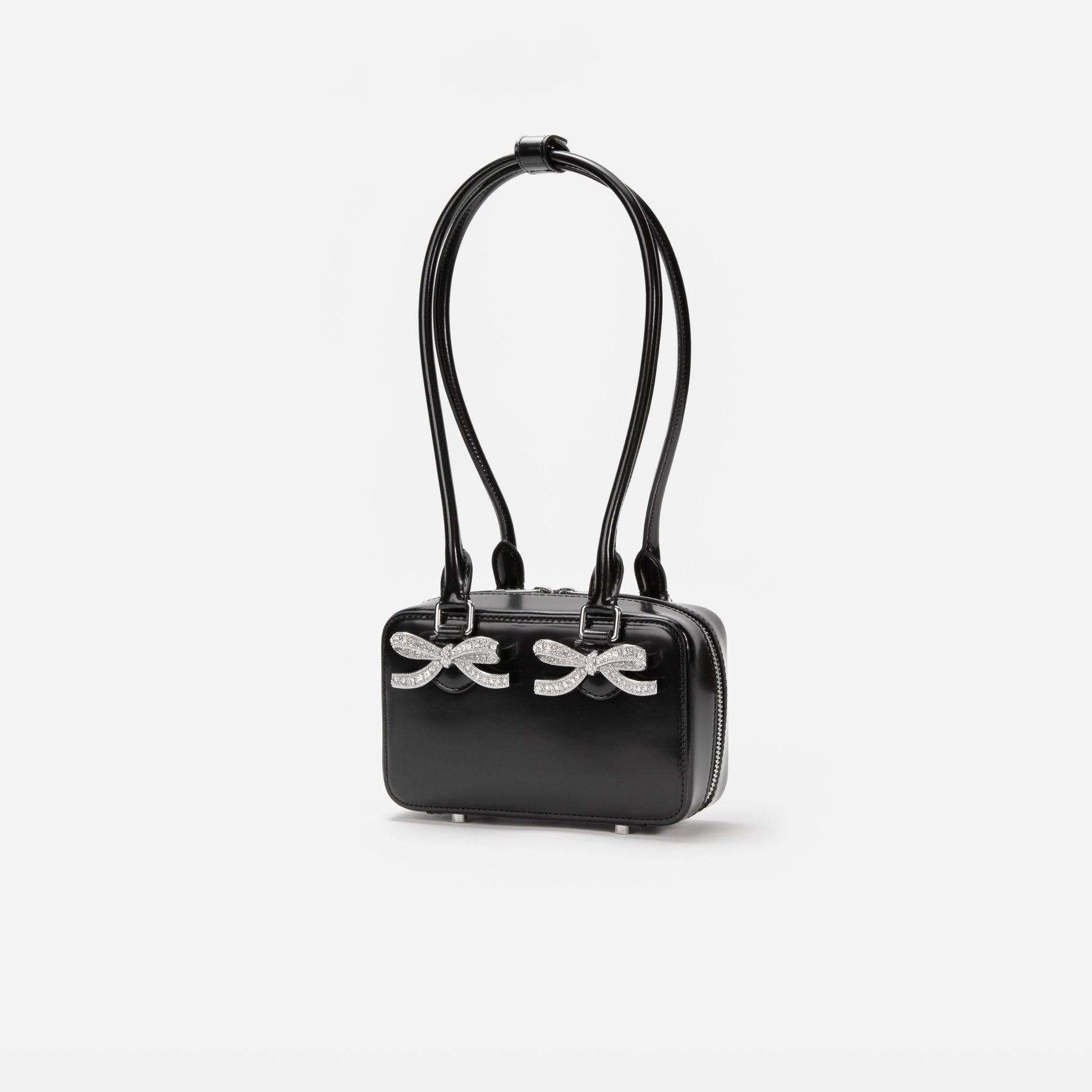 Side view of a woman wearing the Black Leather Shoulder Bag