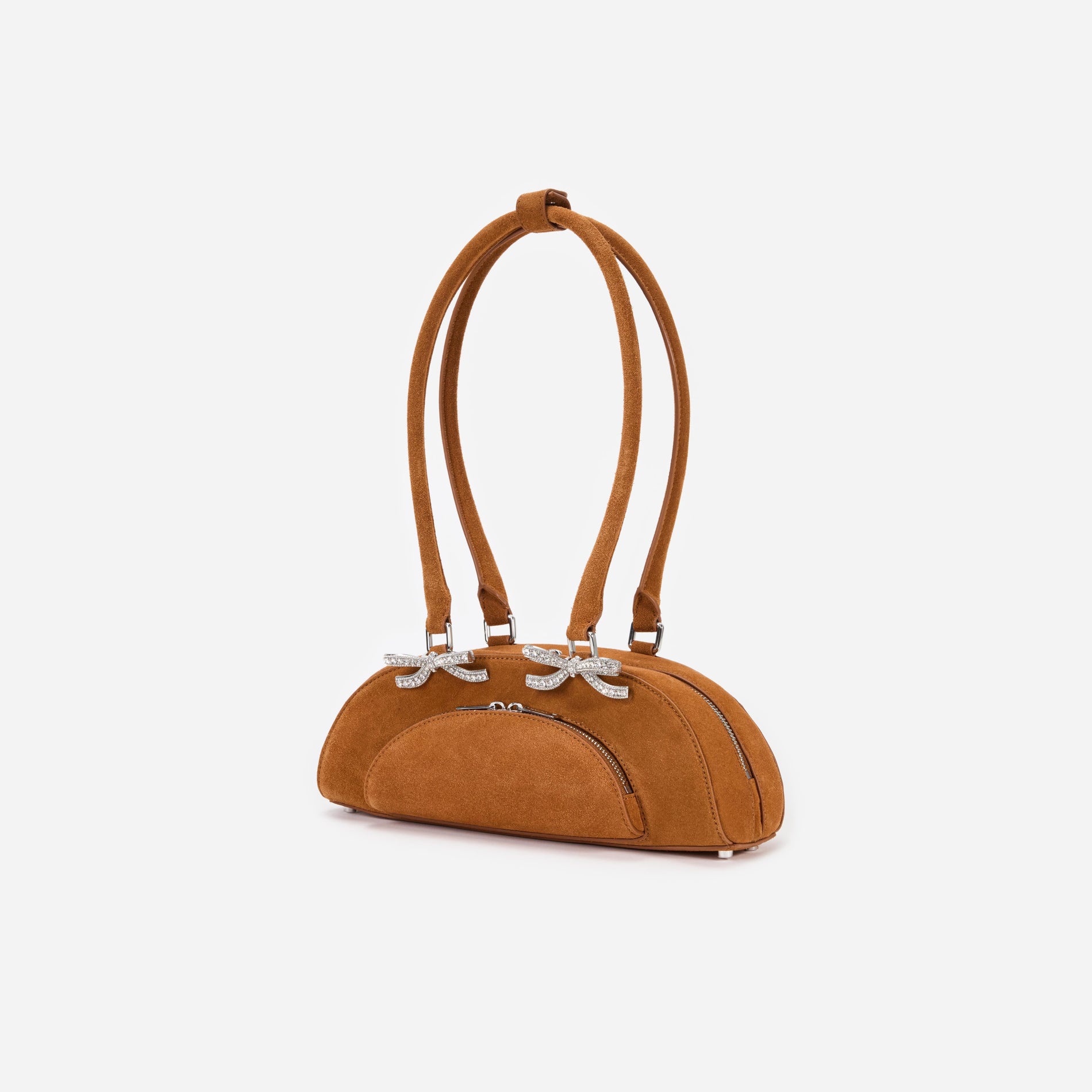 Side view of a woman wearing the Brown Suede Curved Shoulder Bag