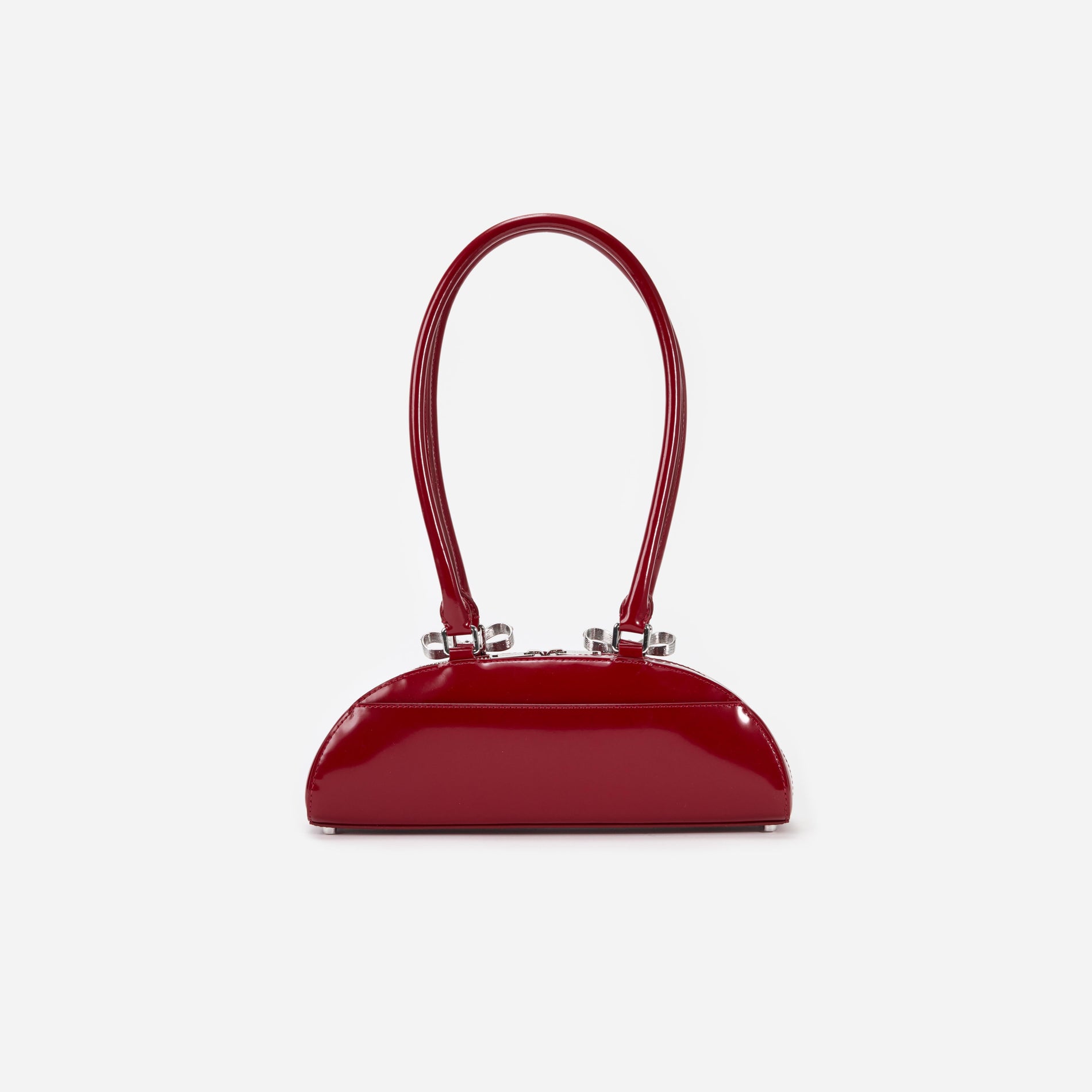 Back view of a woman wearing the Burgundy Leather Curved Shoulder Bag