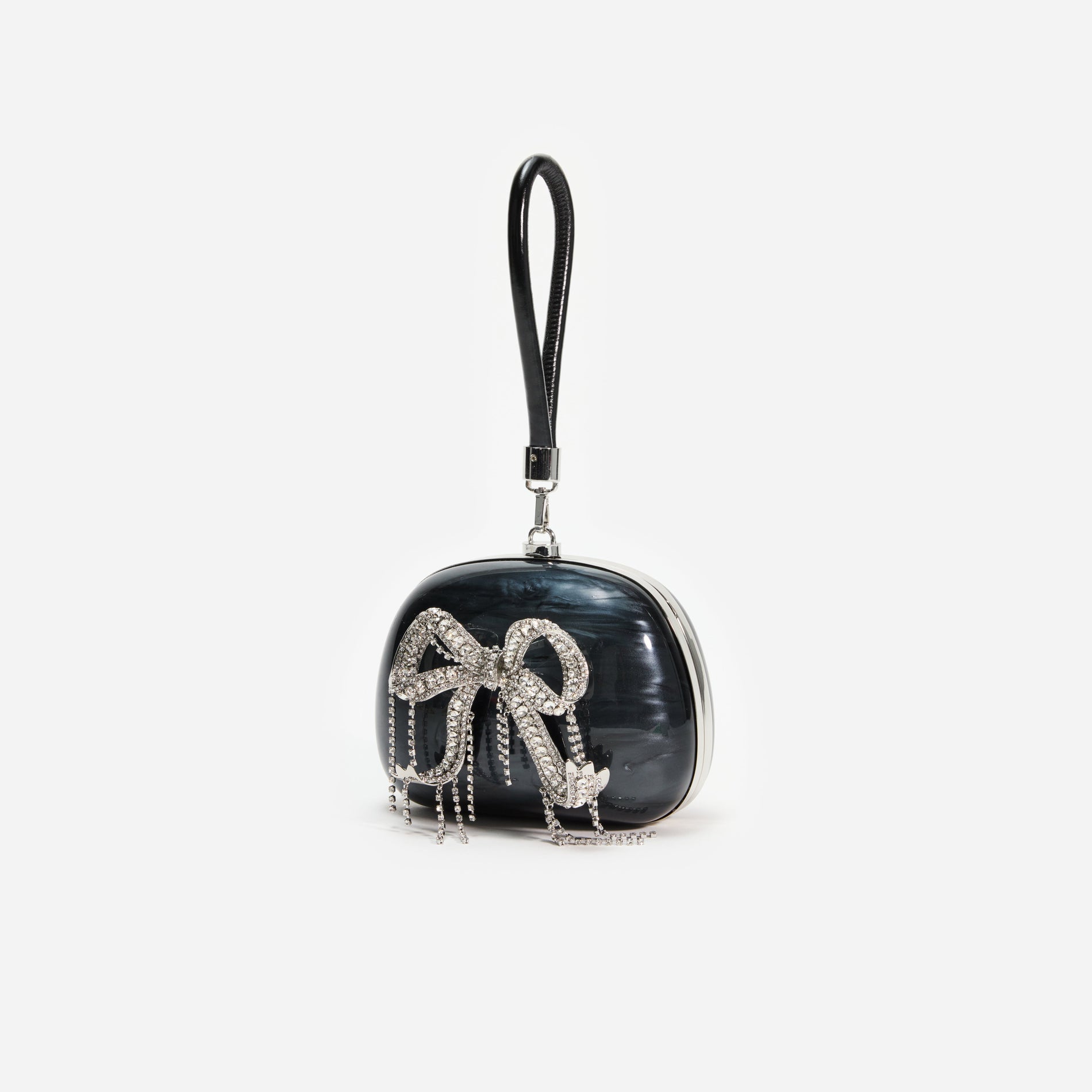 Side view of a woman wearing the Black Pearl Top Handle Clutch Bag