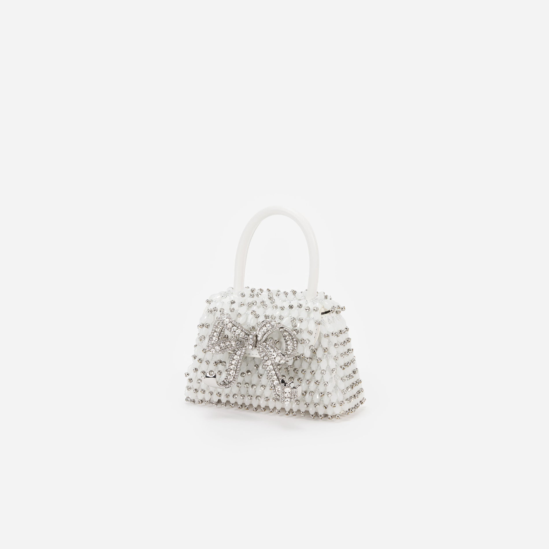 Side view of a woman wearing the White Embellished Micro Bow Bag