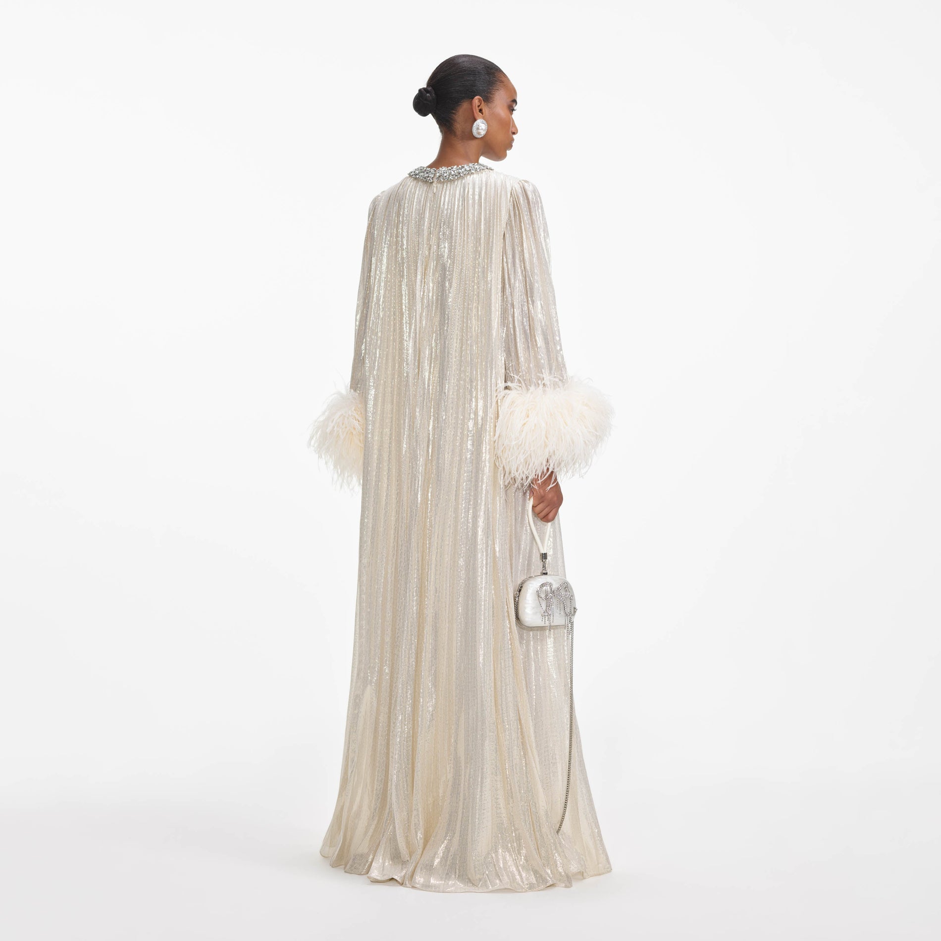 Back view of a woman wearing the Gold Metallic Feather Maxi Dress