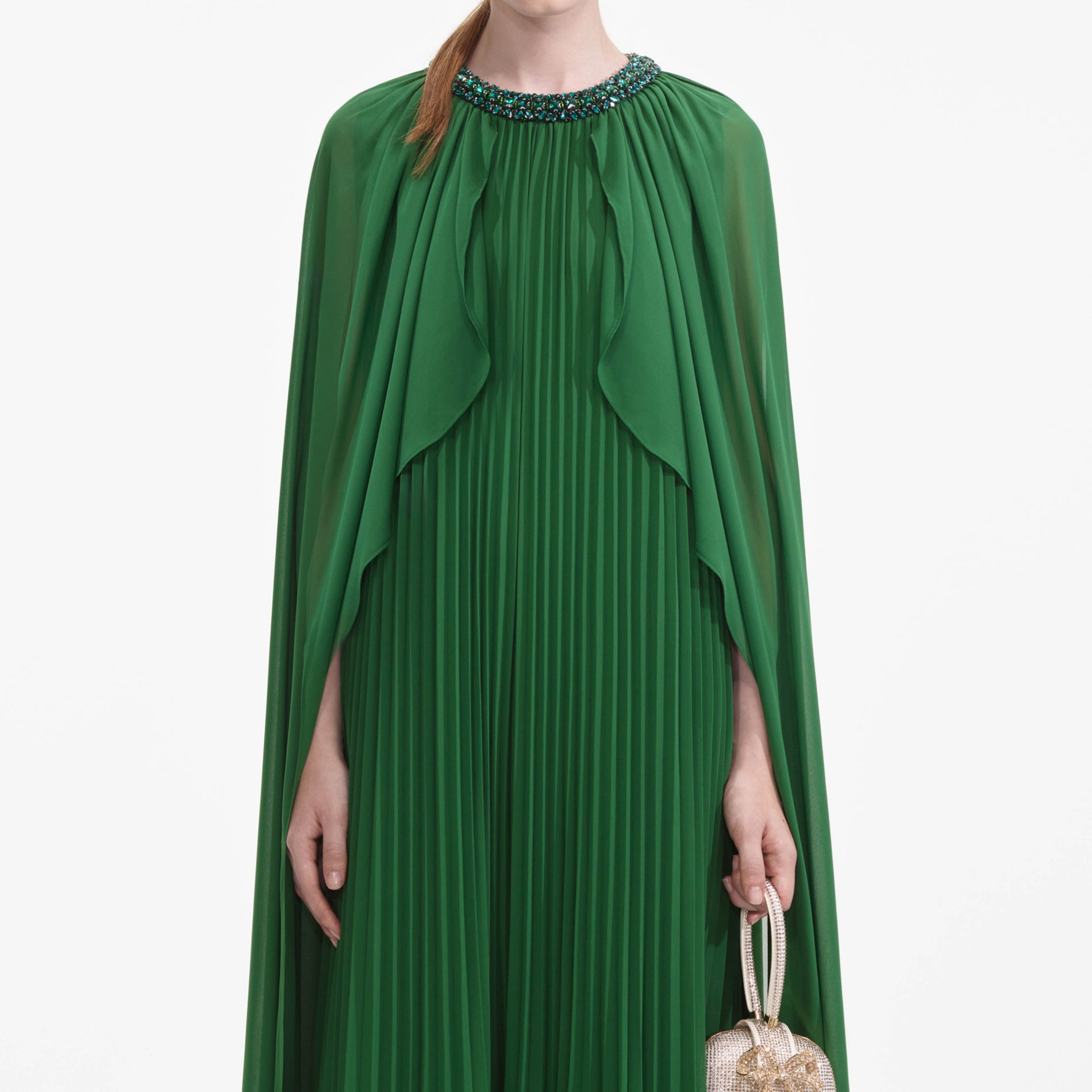 A close up of a woman wearing the Green Chiffon Cape Maxi Dress